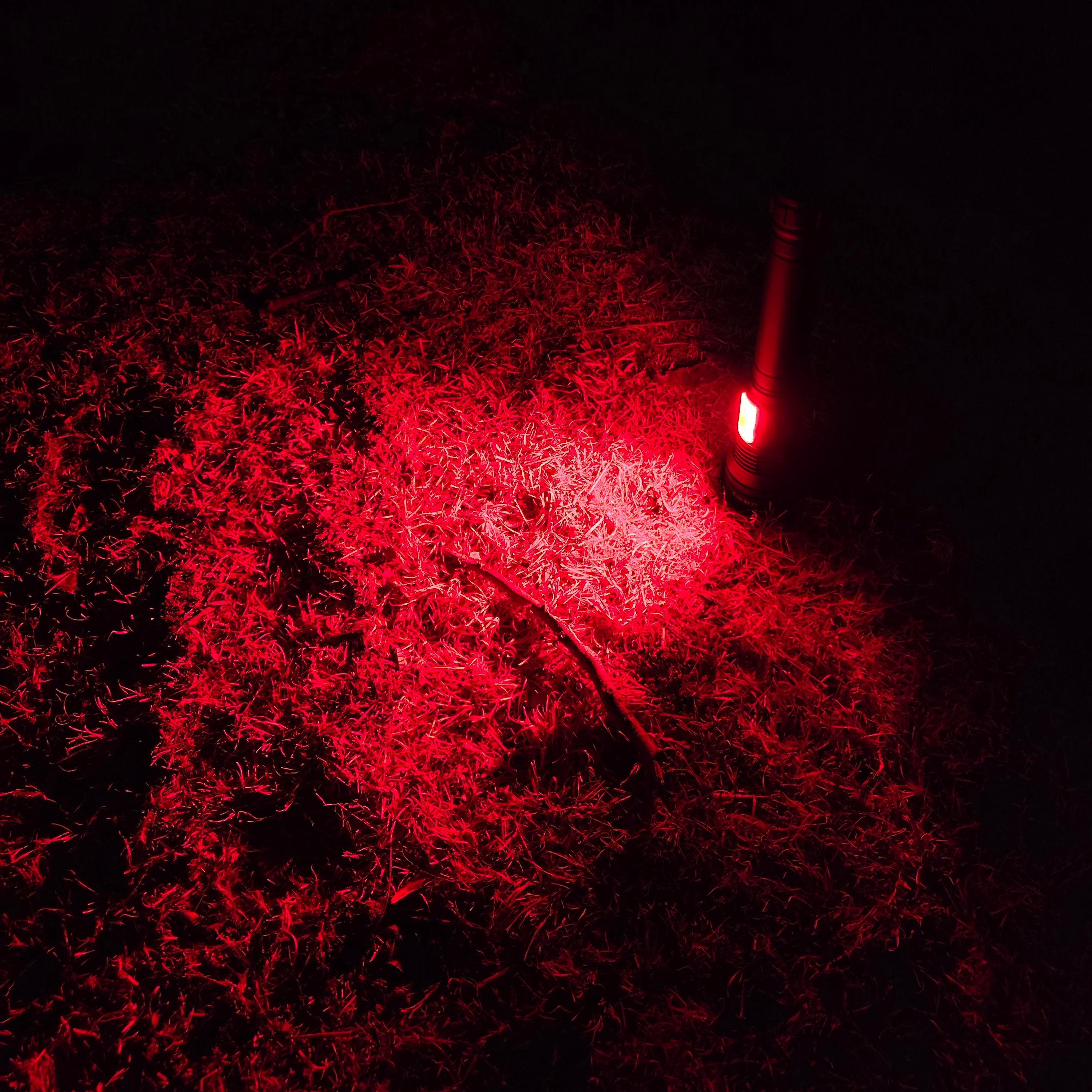 Red Muctac CHARGE LED flashlight with zoomable beam, USB charging, aluminum alloy body, IP65 waterproof, 5000+ lumens.