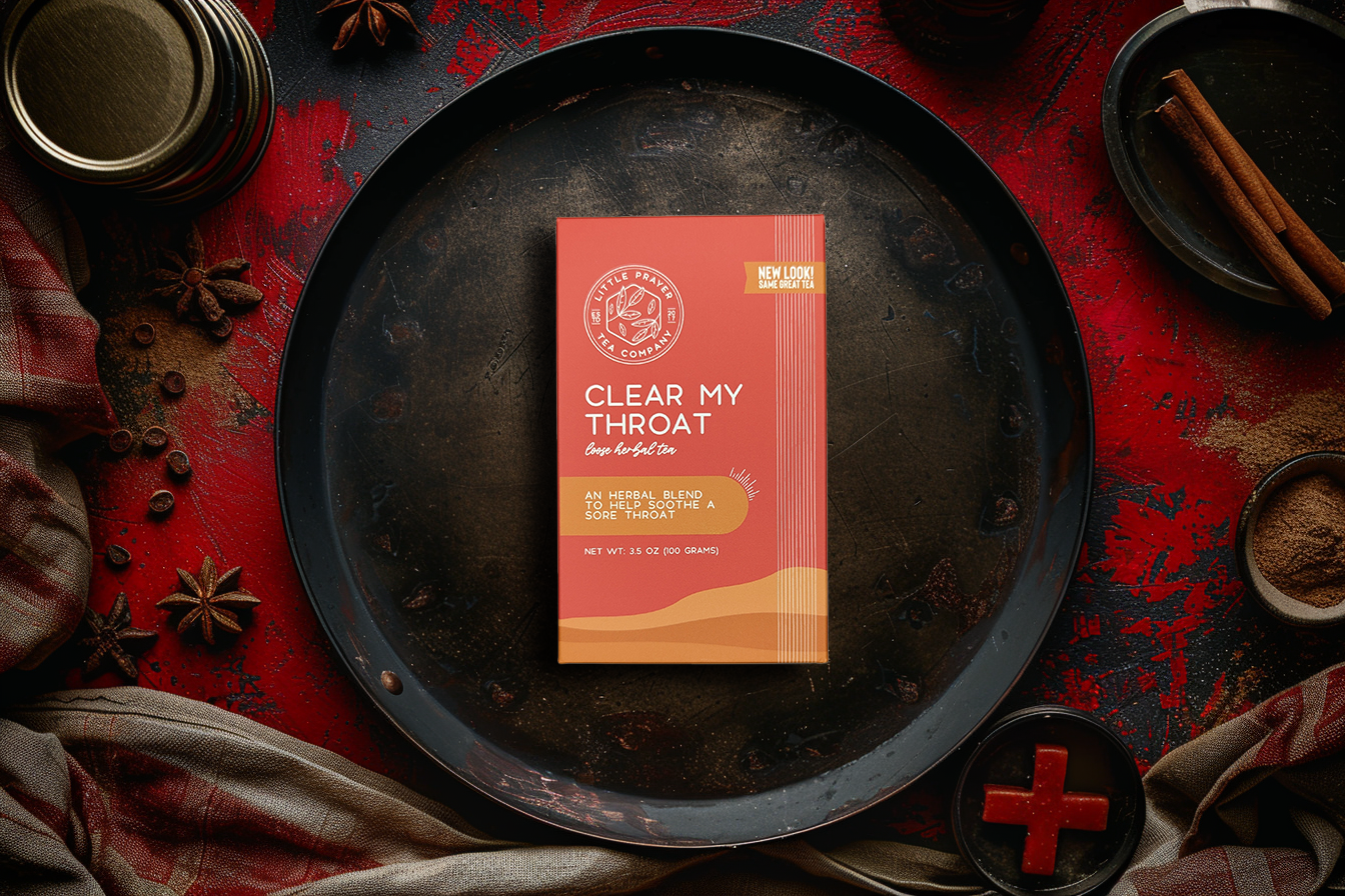 Herbal Clear My Throat Tea by Little Prayer Tea Company in a clear glass cup, showing the herbal tea's warm, soothing appearance.