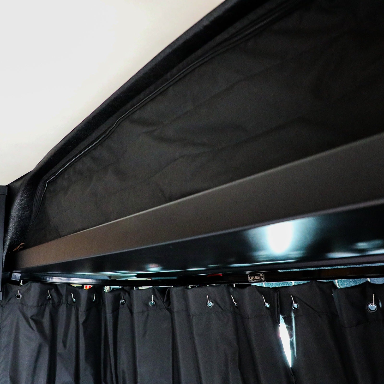 Canyon Adventure Vans CLIMA-SHADE™ insulated cab shelf cover in a vehicle interior, showcasing its fit and design.