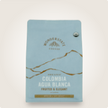 Front view of Wonderstate Coffee Organic Colombia Agua Blanca coffee bag with vibrant label design.