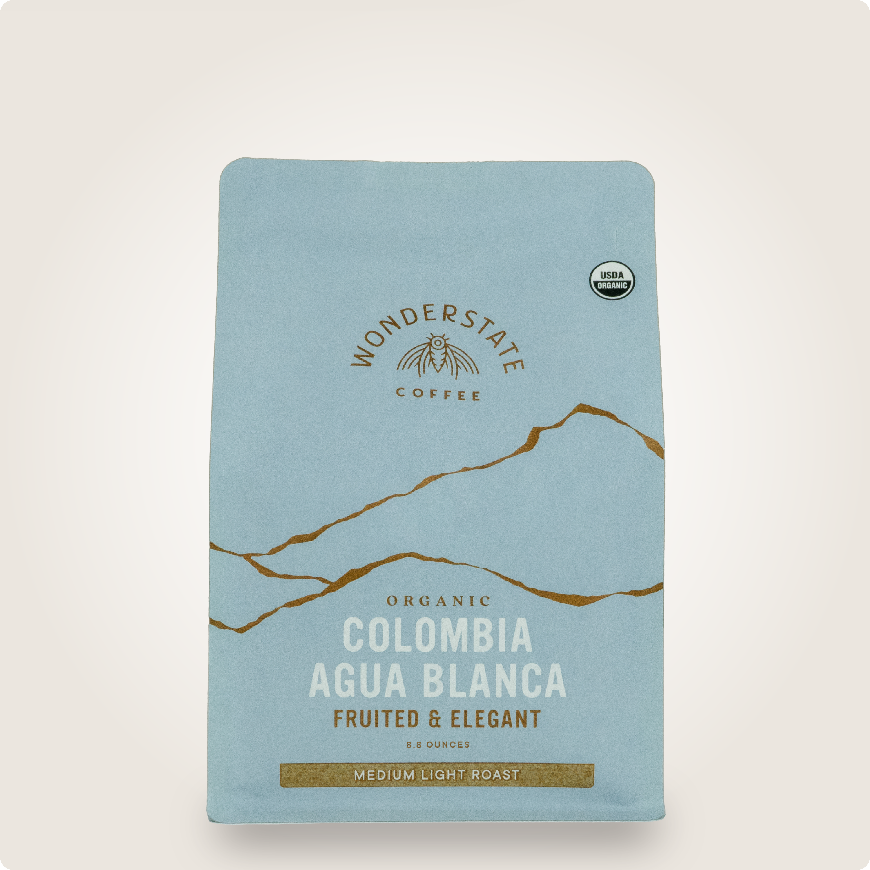 Front view of Wonderstate Coffee Organic Colombia Agua Blanca coffee bag with vibrant label design.