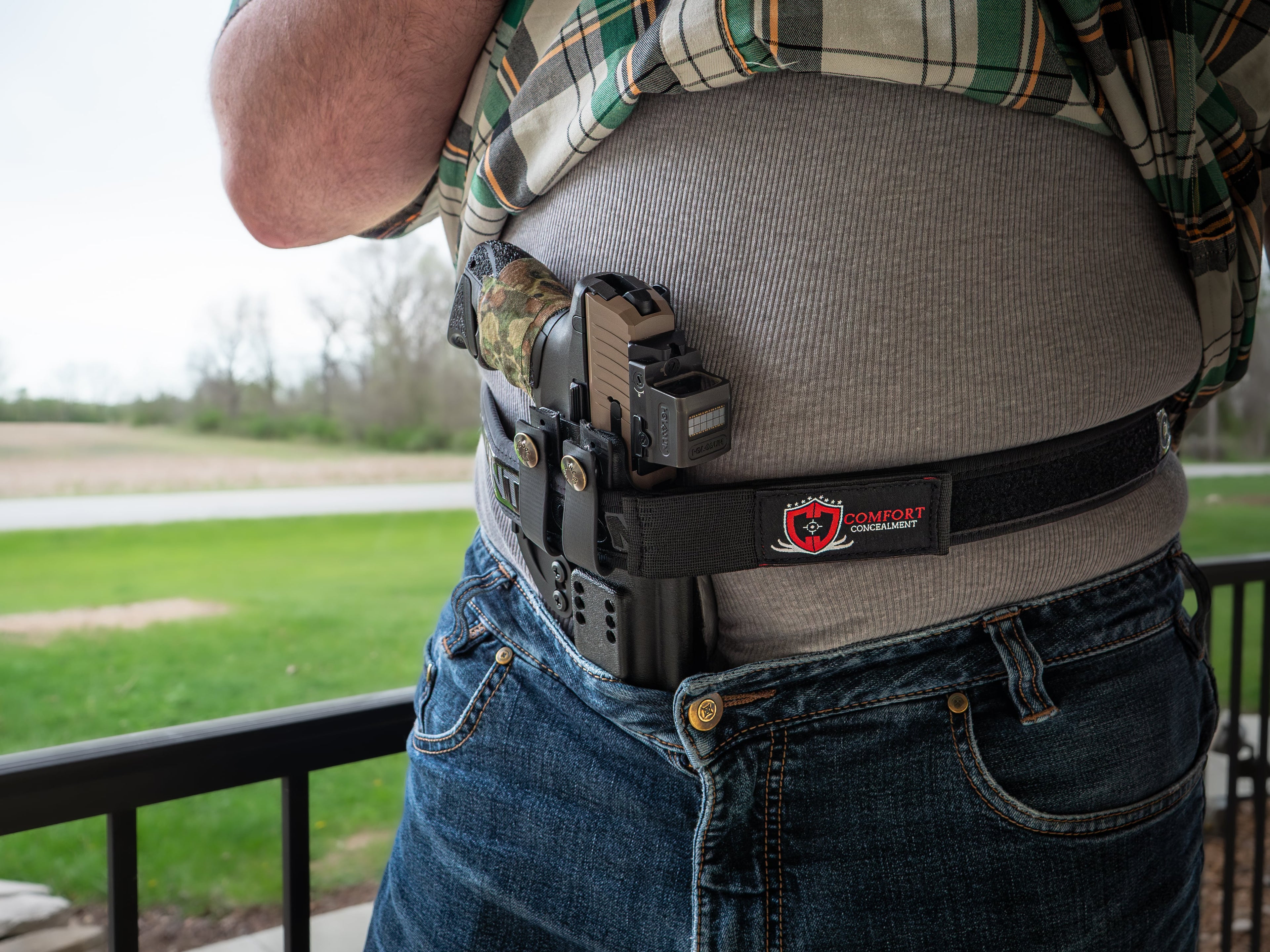 Comfort Concealment BLACKOUT 2.0™ concealed carry belt shown in a lifestyle setting, highlighting its durable design and secure fit.