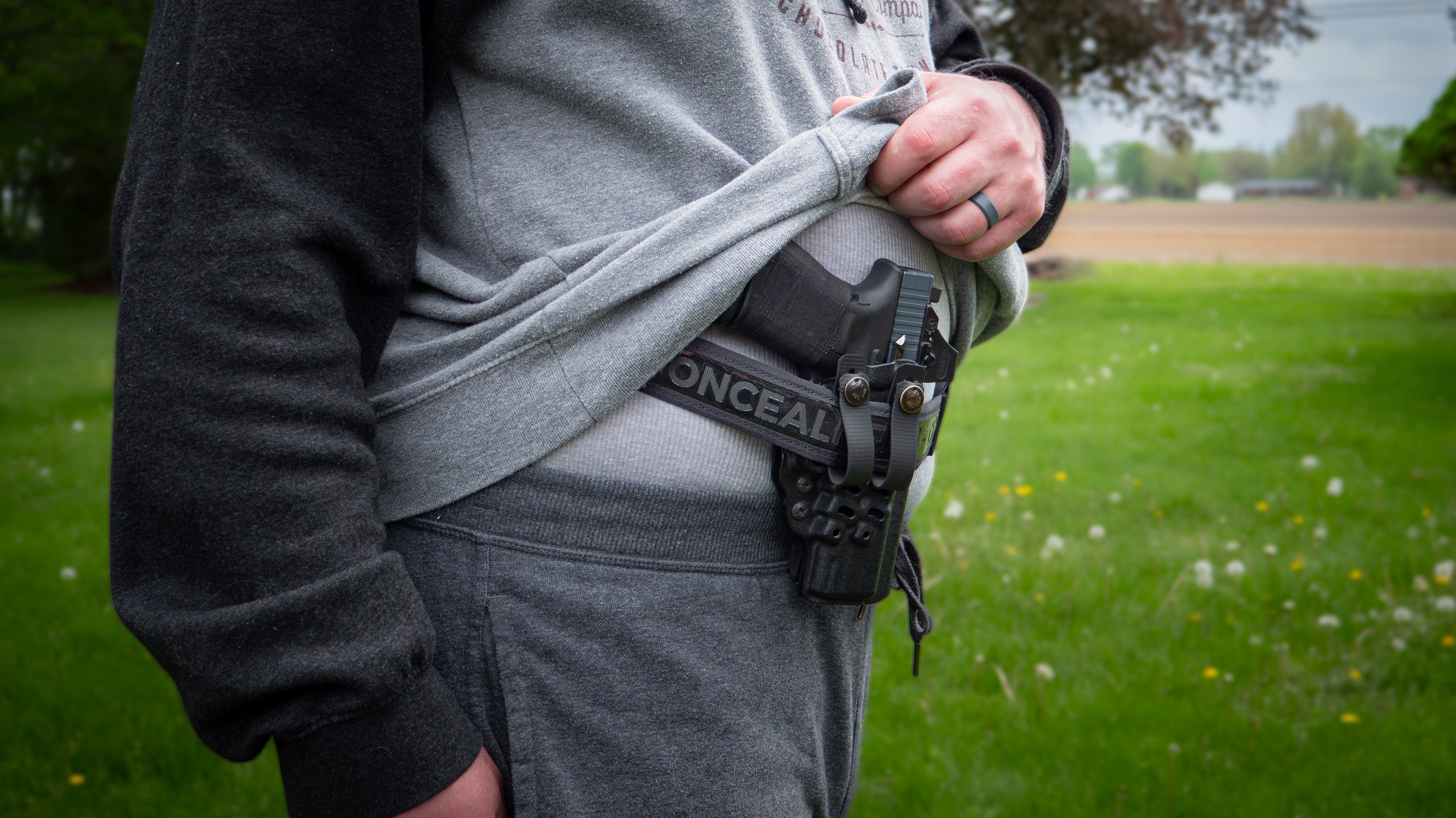 Comfort Concealment BLACKOUT 2.0™ concealed carry belt shown in a lifestyle setting, highlighting its durable design and secure fit.
