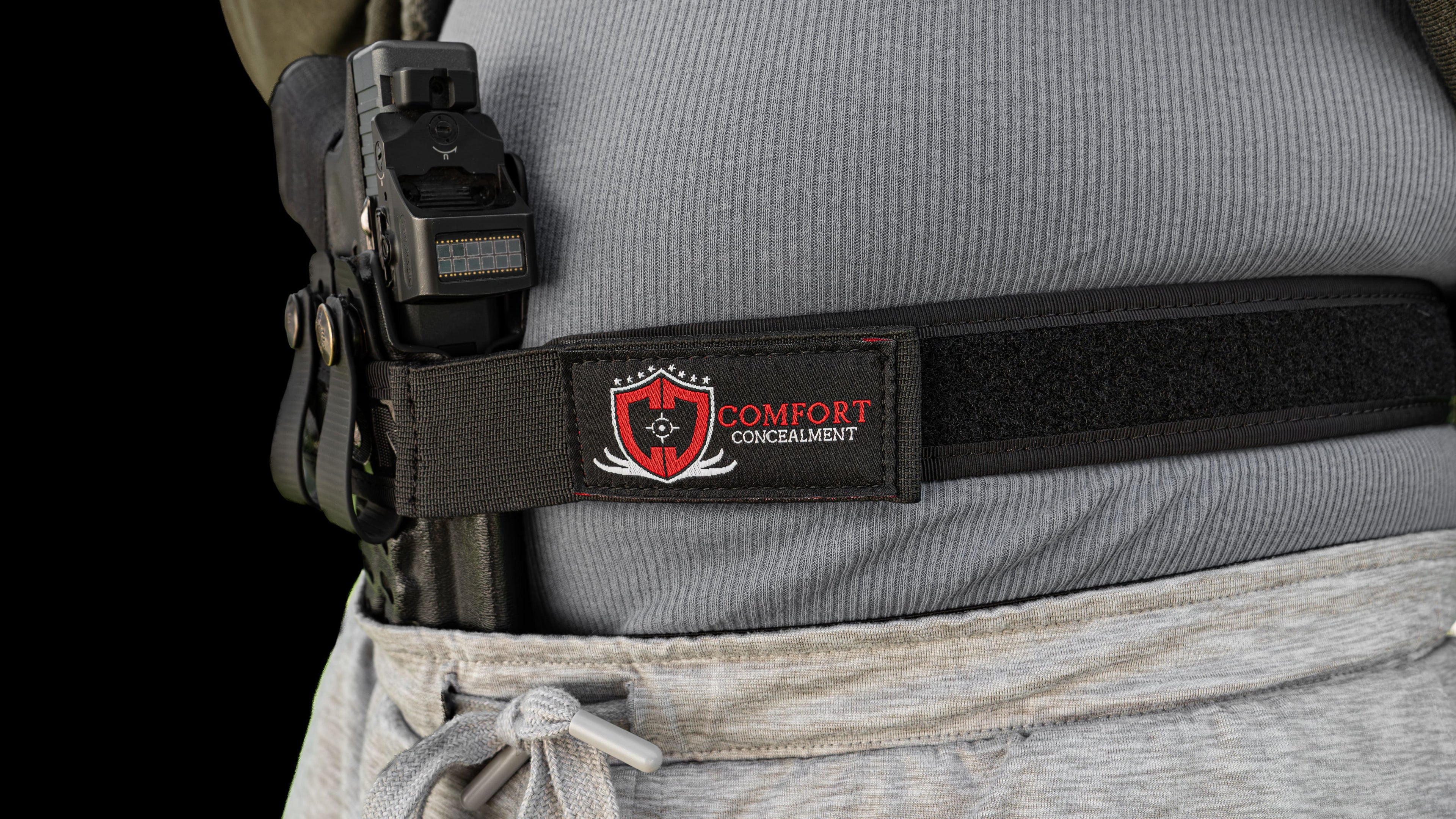 Comfort Concealment BLACKOUT 2.0 concealed carry belt shown in a lifestyle setting, durable black design with secure buckle.