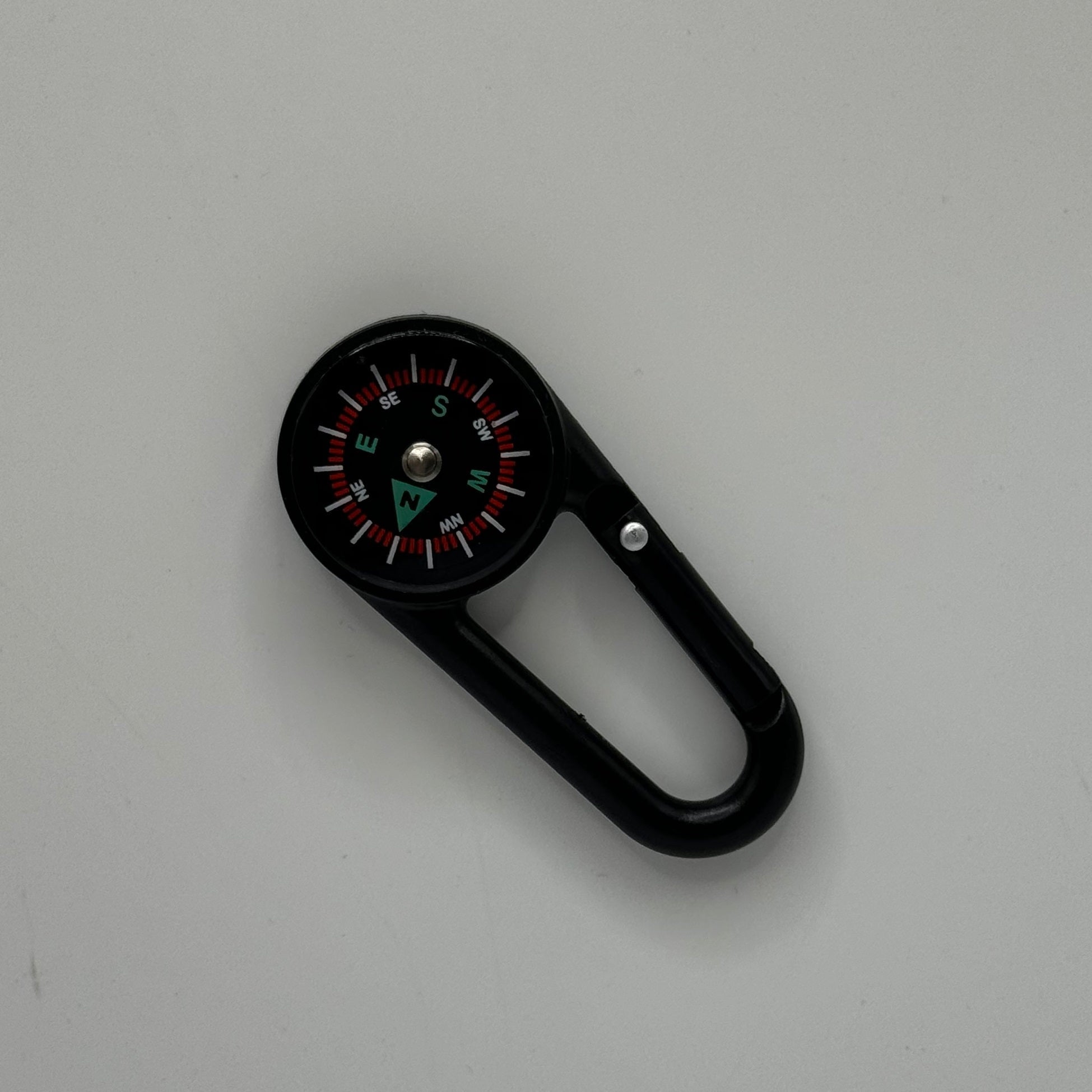 Rexing hiking backpacking compass with adjustable bezel and luminous needle for outdoor navigation and exploration.