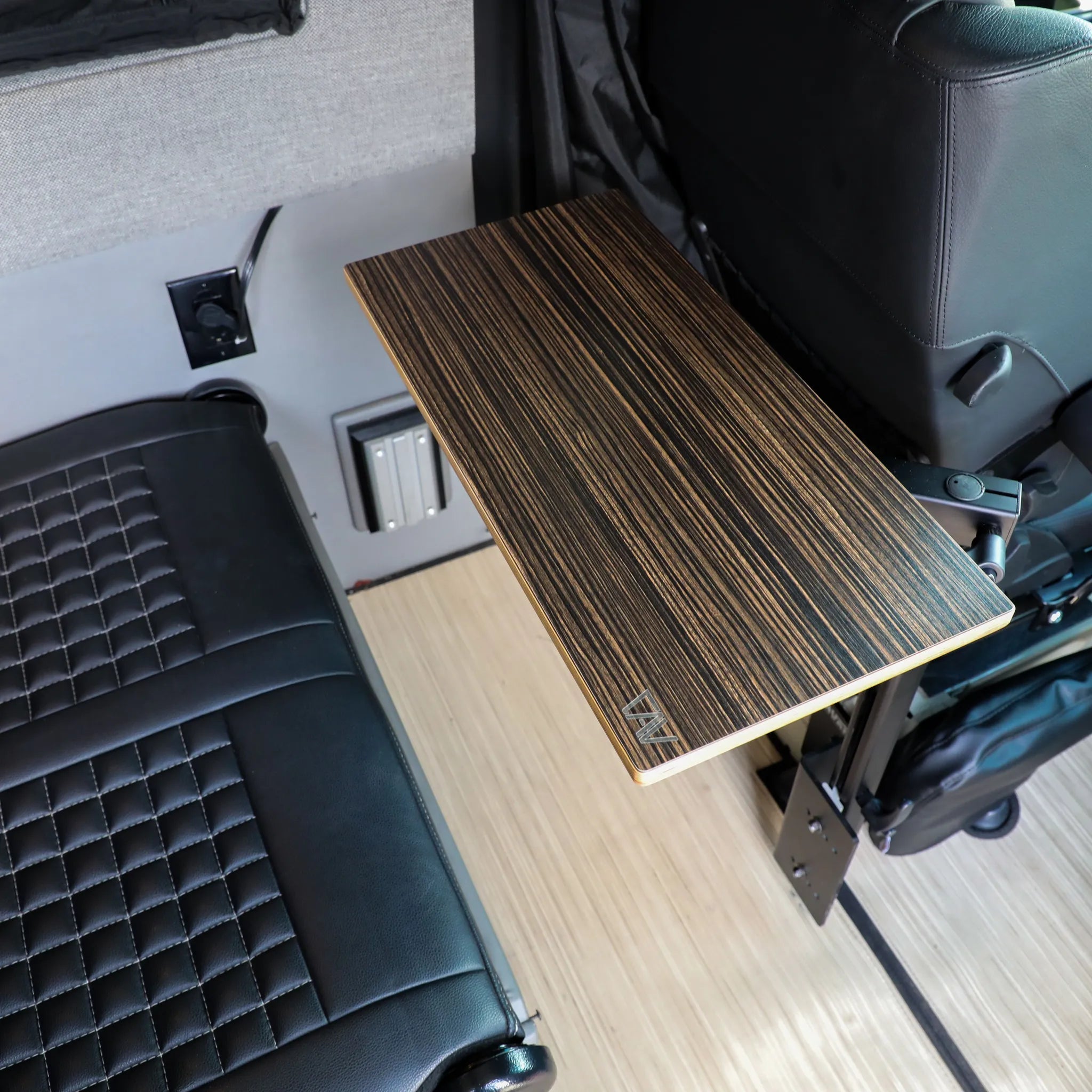 Canyon Adventure Vans small universal table top from CAV branded products, shown on a vehicle console surface.