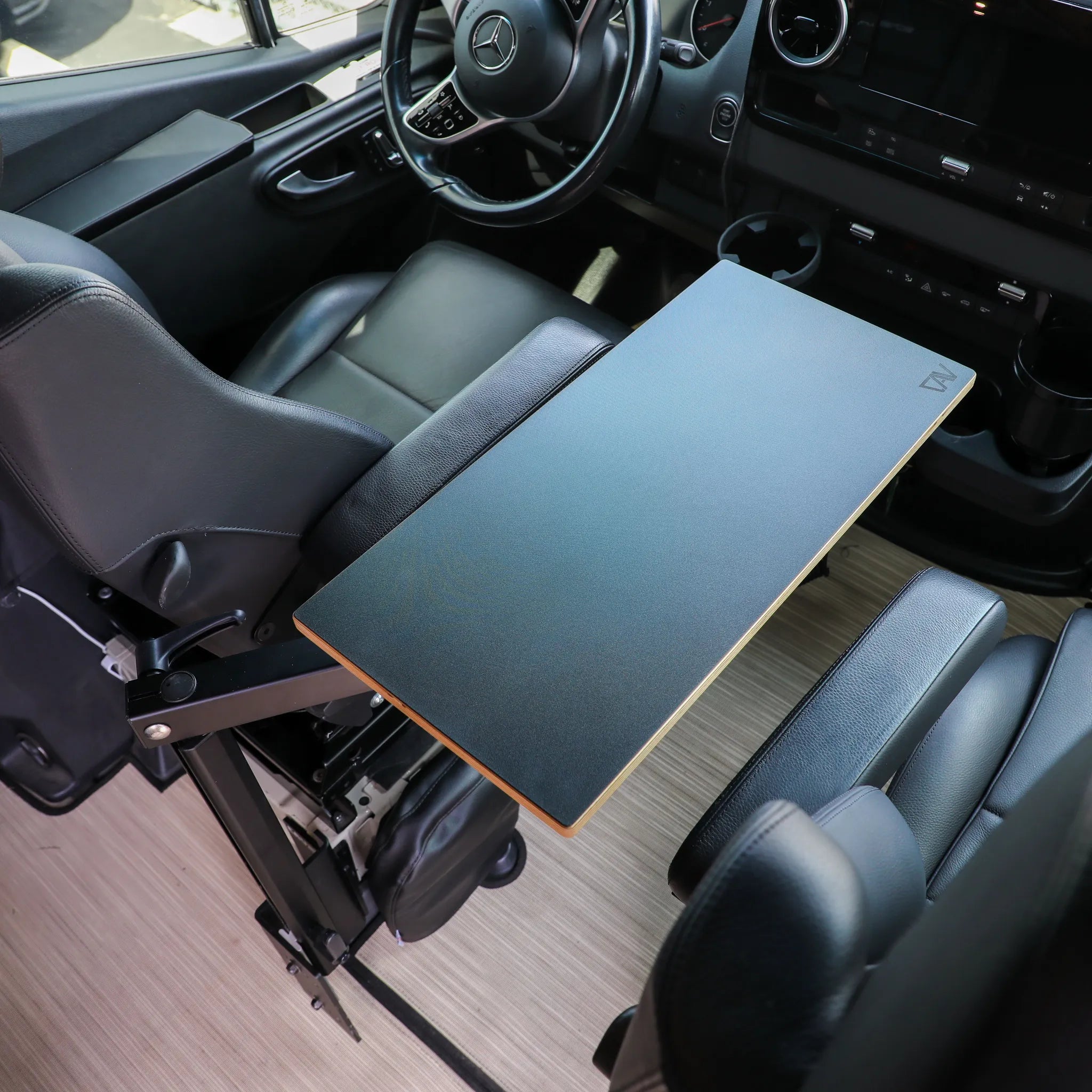 Small universal table top by Canyon Adventure Vans, designed for CAV branded products, shown on a console surface.