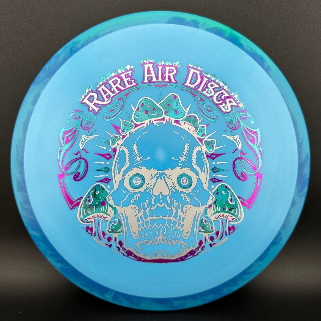 Rare Air Discs Fission Defy Crushin' Amanitas VIP 2.0 disc golf disc displayed on a light background.