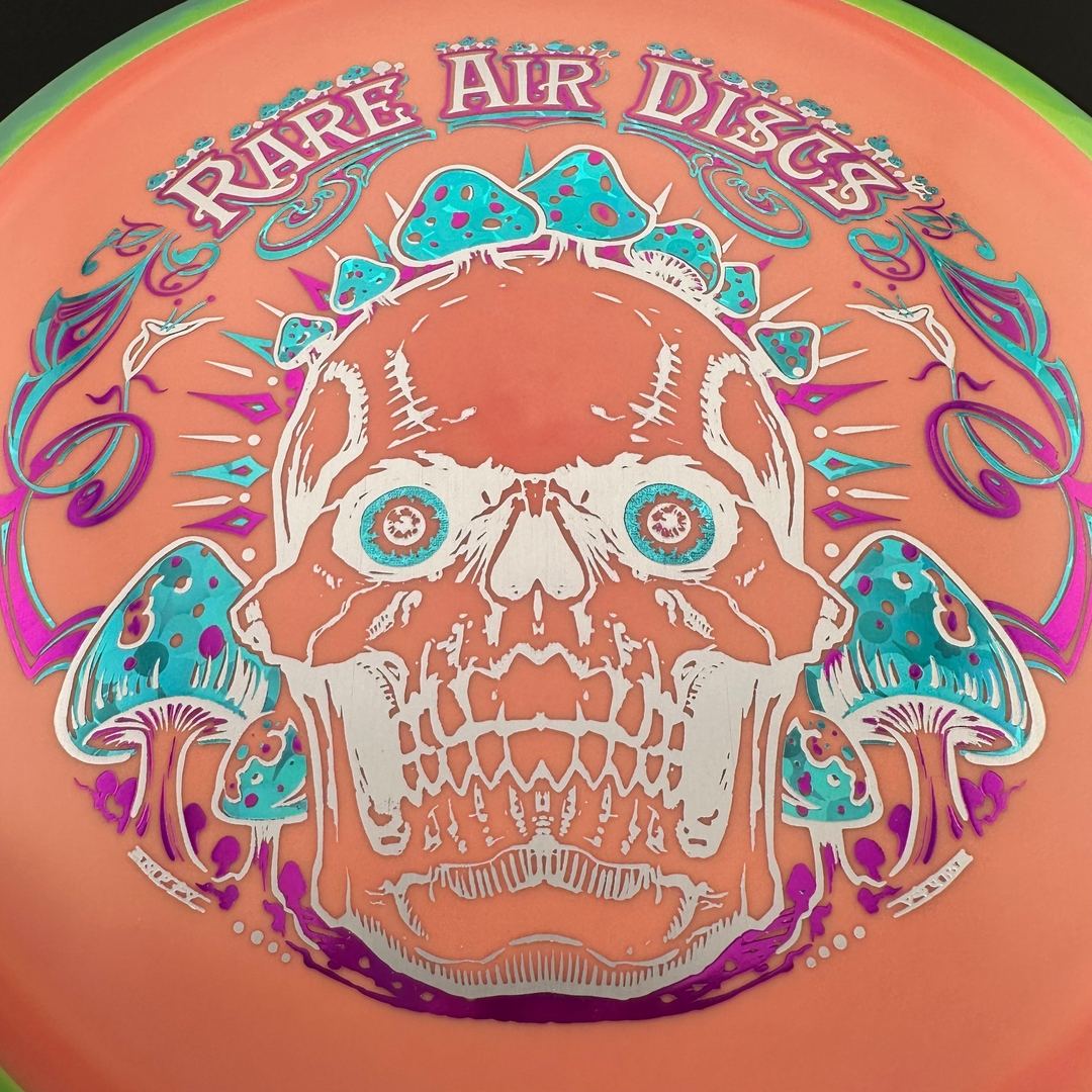 Rare Air Discs Fission Defy Crushin' Amanitas VIP 2.0 disc golf disc with vibrant design and bold branding on the flight surface.