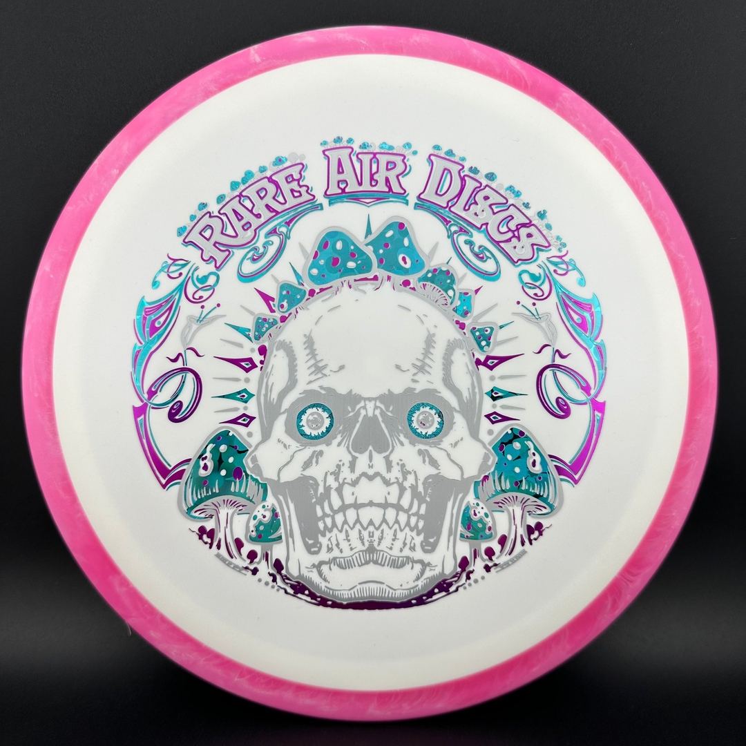 Rare Air Discs Fission Defy Crushin' Amanitas VIP 2.0 disc golf disc with vibrant design and bold branding.