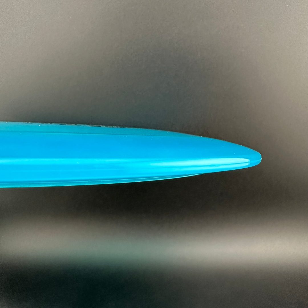 Disc golf Gummy C-Blend Aztec disc by Rare Air Discs, featuring vibrant colors and detailed Aztec design on the top surface.