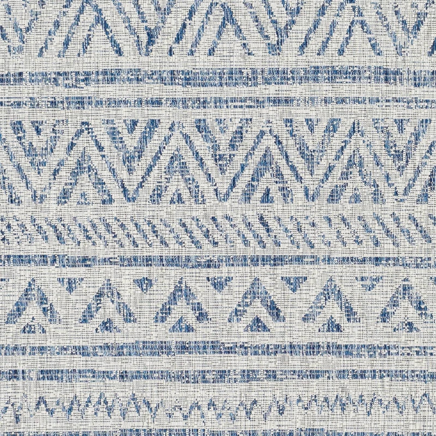 Blue grey chevron coastal boho style indoor outdoor area rug by HomePacific, 5 ft by 7.5 ft, with geometric pattern and textured surface.