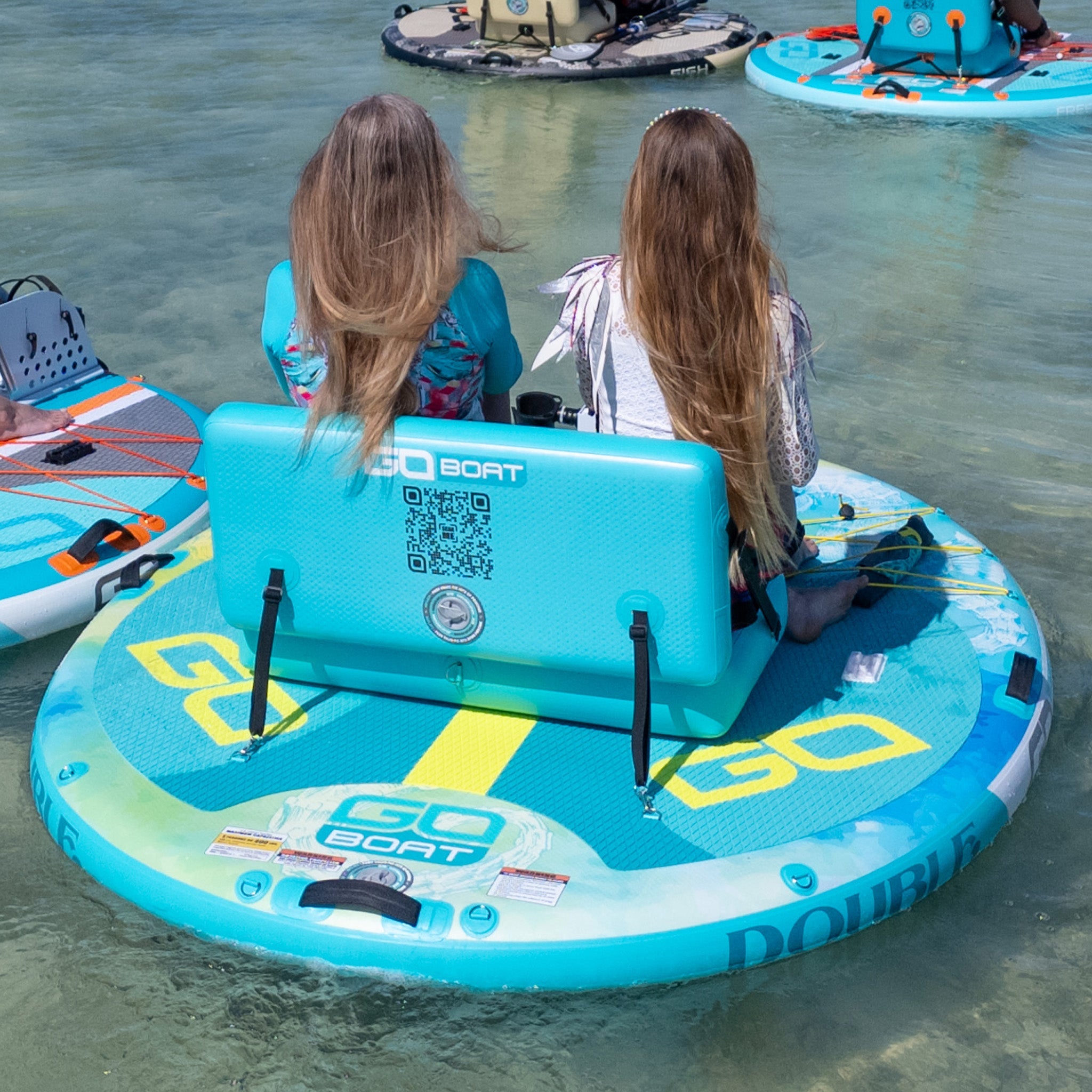 Double Freedom watercraft by GoBoat, featuring sleek design and stable double-hull construction on calm water.