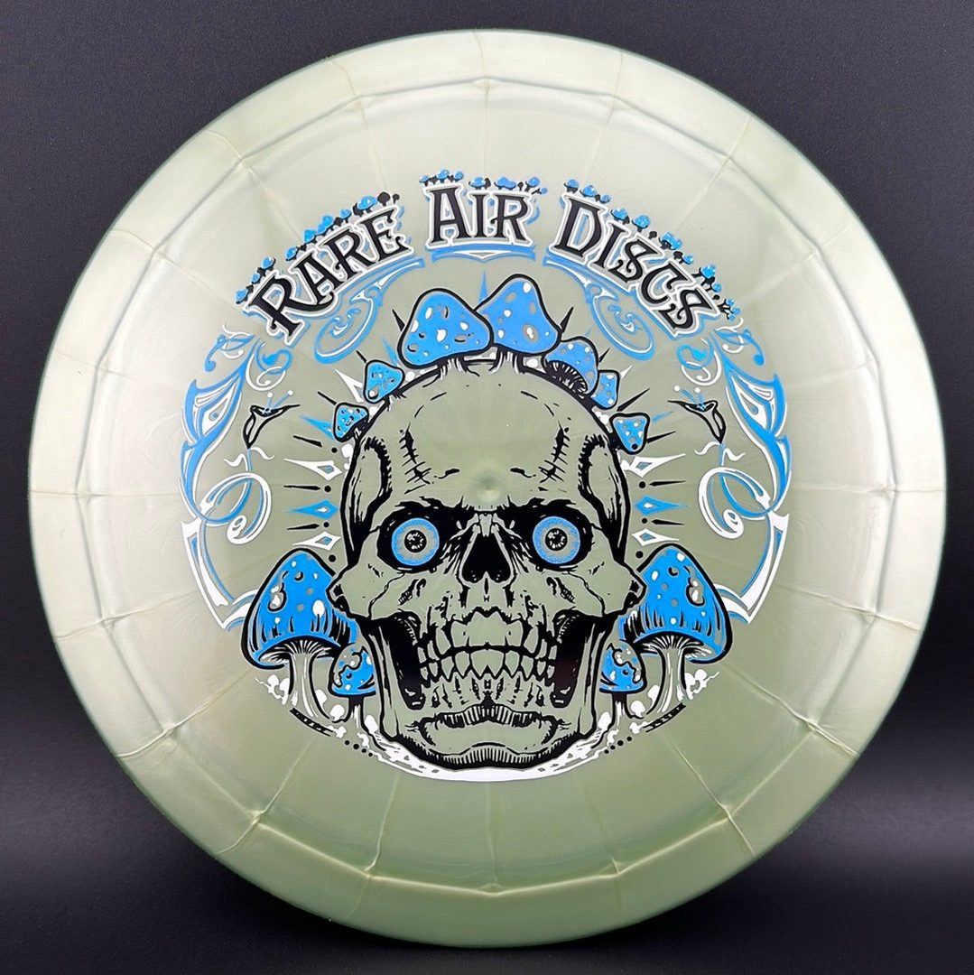 Ethereal Construct Crushin' Amanitas disc golf stamp by Manny Trujillo on a disc, featuring vibrant mushroom and nature-inspired artwork.