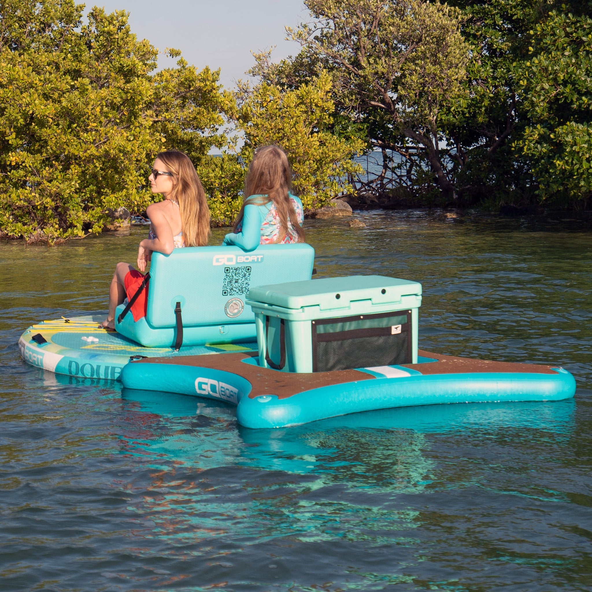 A GoBoat Double Freedom watercraft floating on water, showcasing its sleek design and spacious seating for outdoor water adventures.