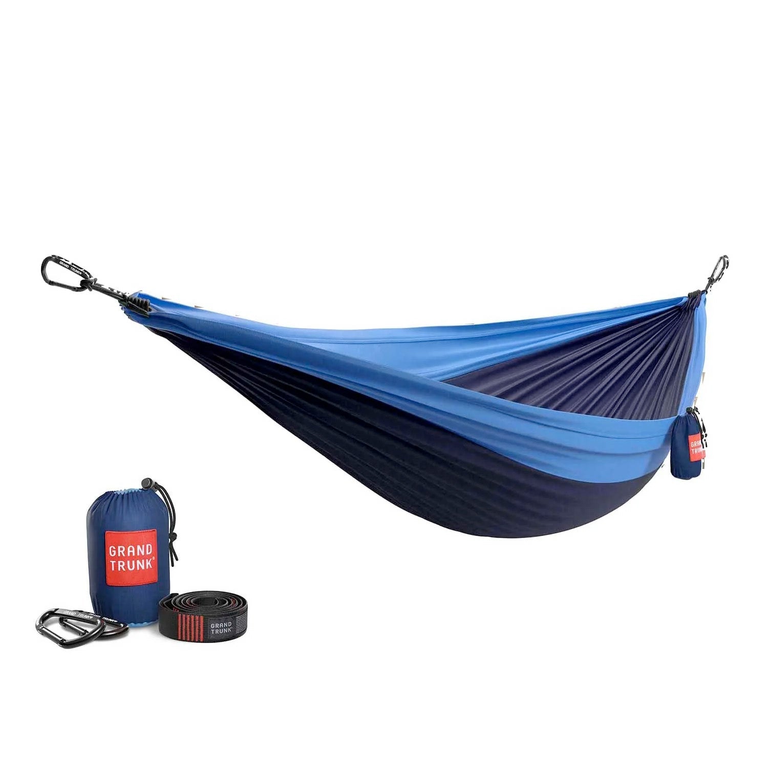 GrandTrunk Double Deluxe hammock with straps, shown outdoors, featuring comfortable fabric and sturdy hanging setup.