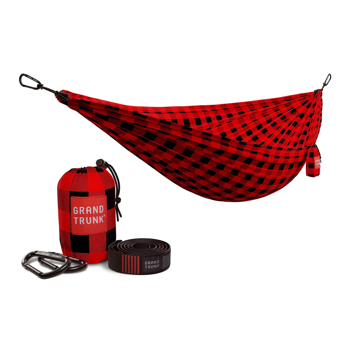 Double Deluxe Hammock by GrandTrunk with sturdy straps, shown in a relaxed outdoor setting, perfect for lounging and camping.