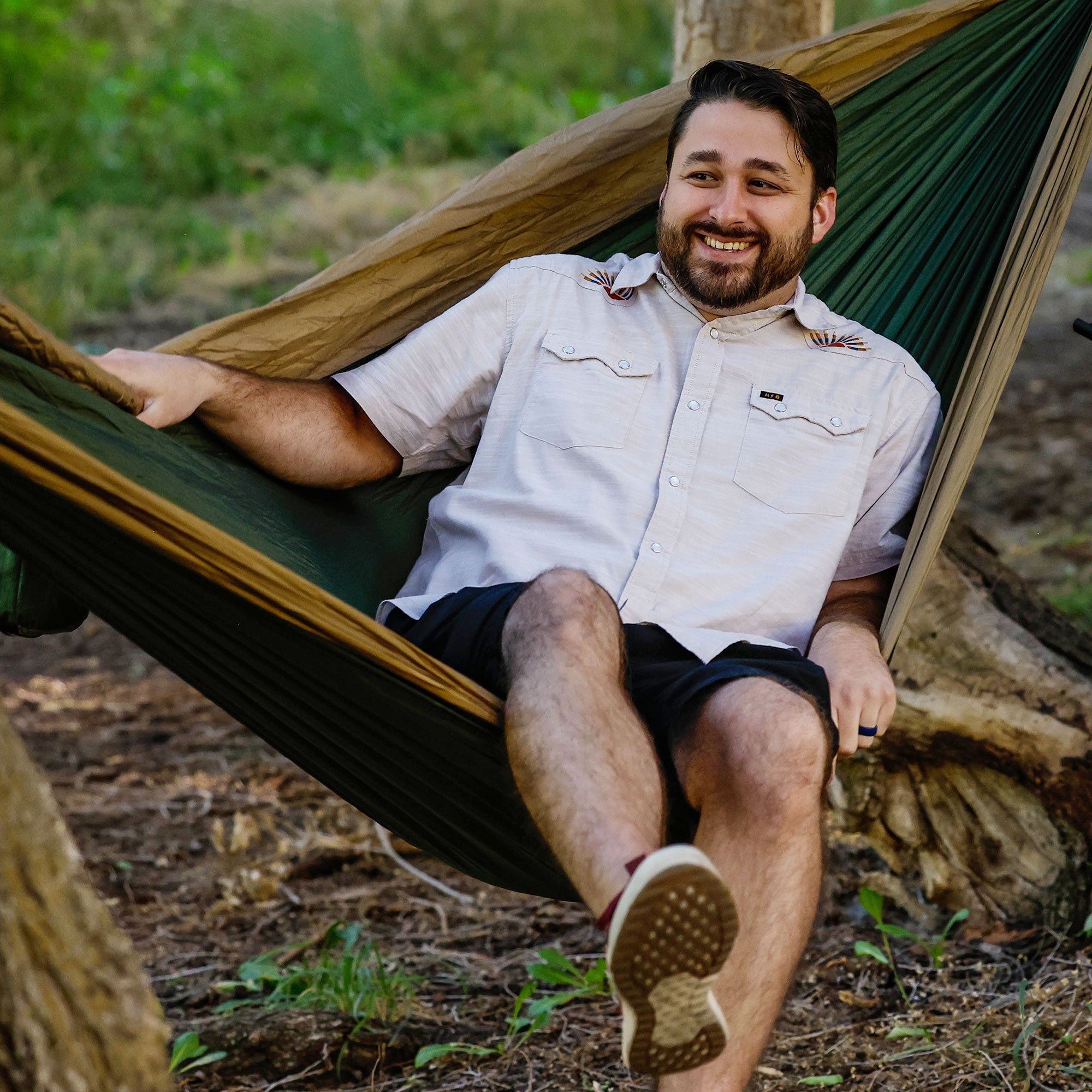 GrandTrunk Double Deluxe Hammock with straps shown, featuring soft fabric and sturdy construction for outdoor relaxation.