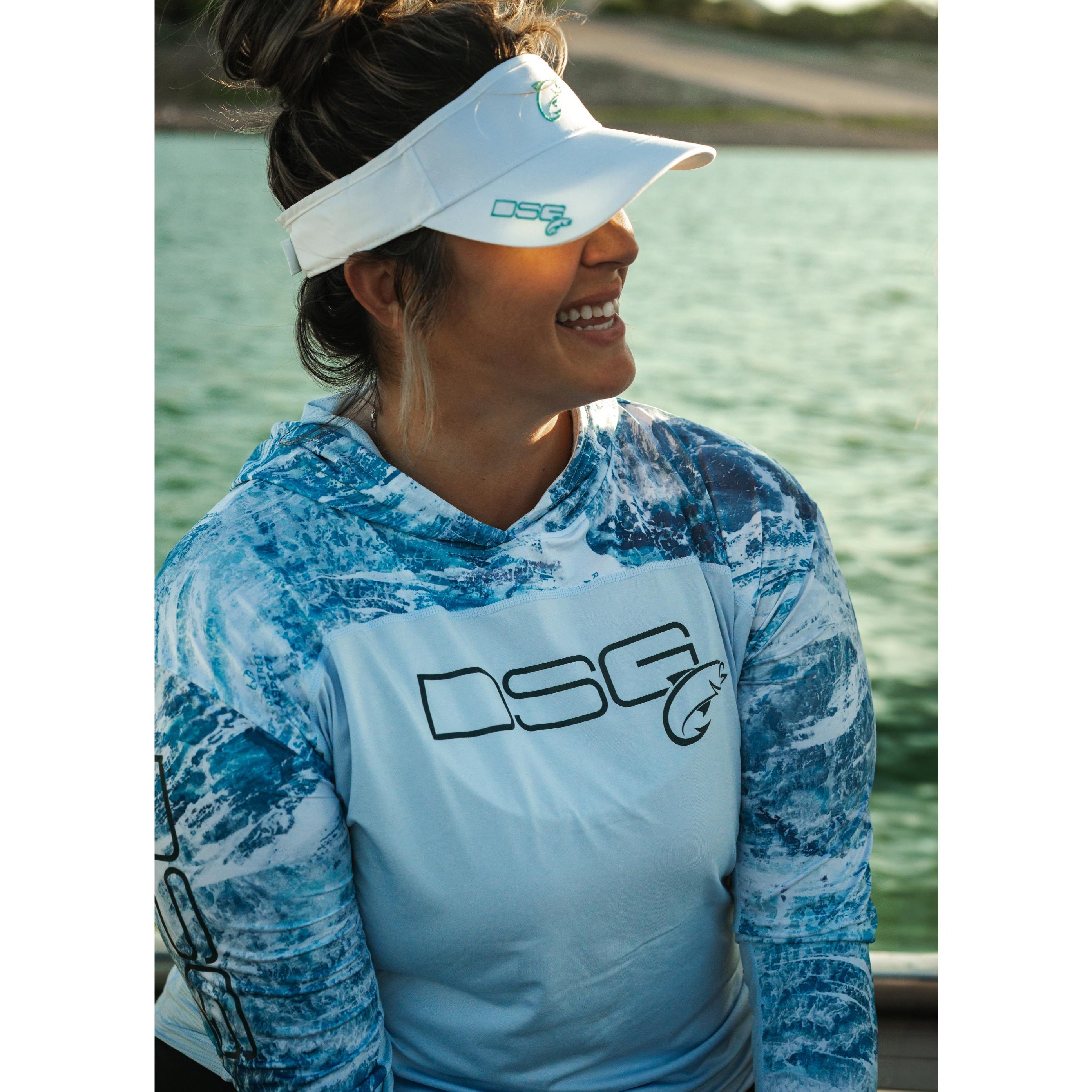 DSG OUTERWEAR Chloe hooded shirt with UPF 50+ protection, shown in a relaxed fit with a front pocket and adjustable hood.