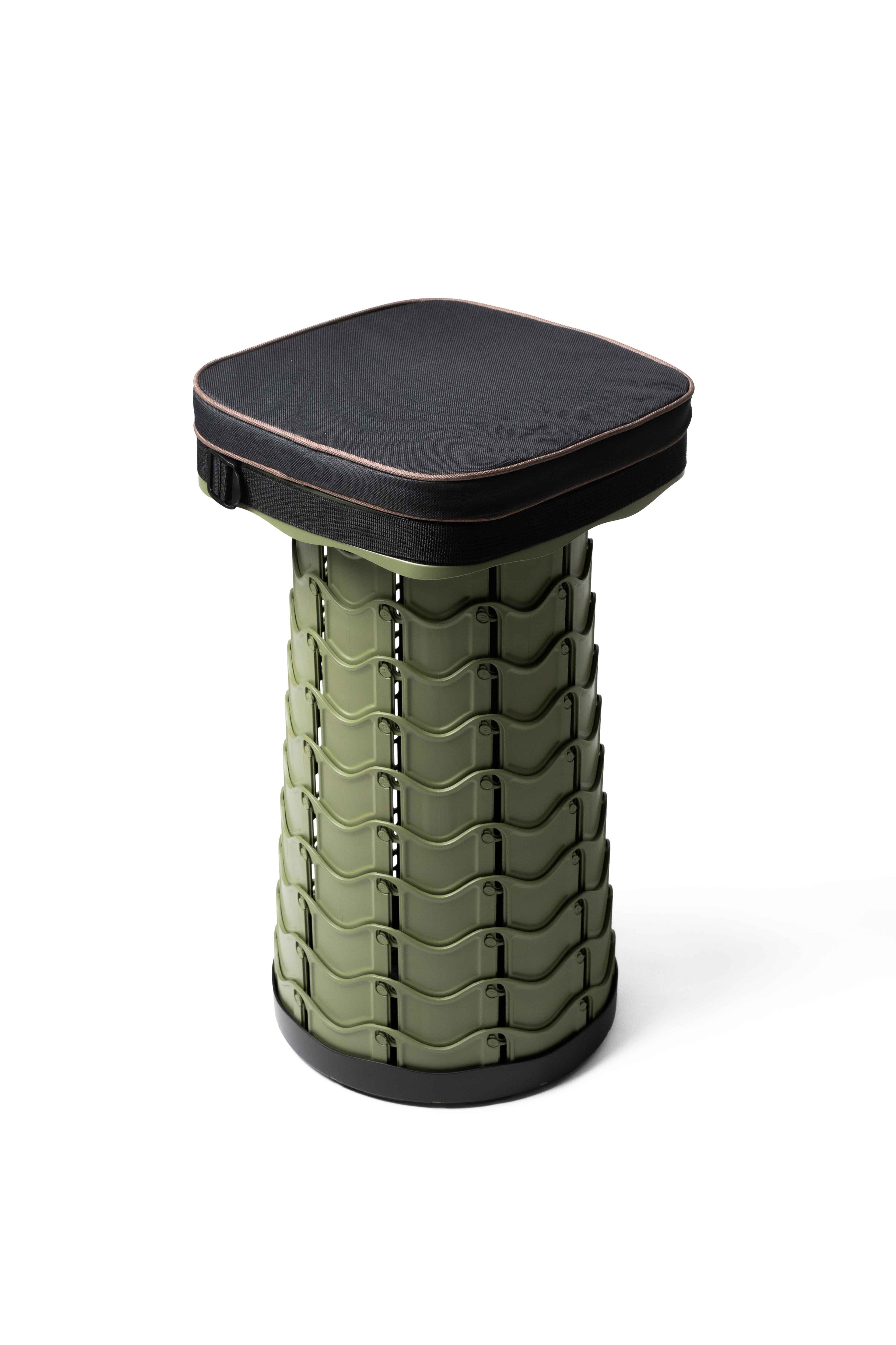 EverUncharted Nomad Cush in black-brown fabric with textured design, placed on a wooden surface.