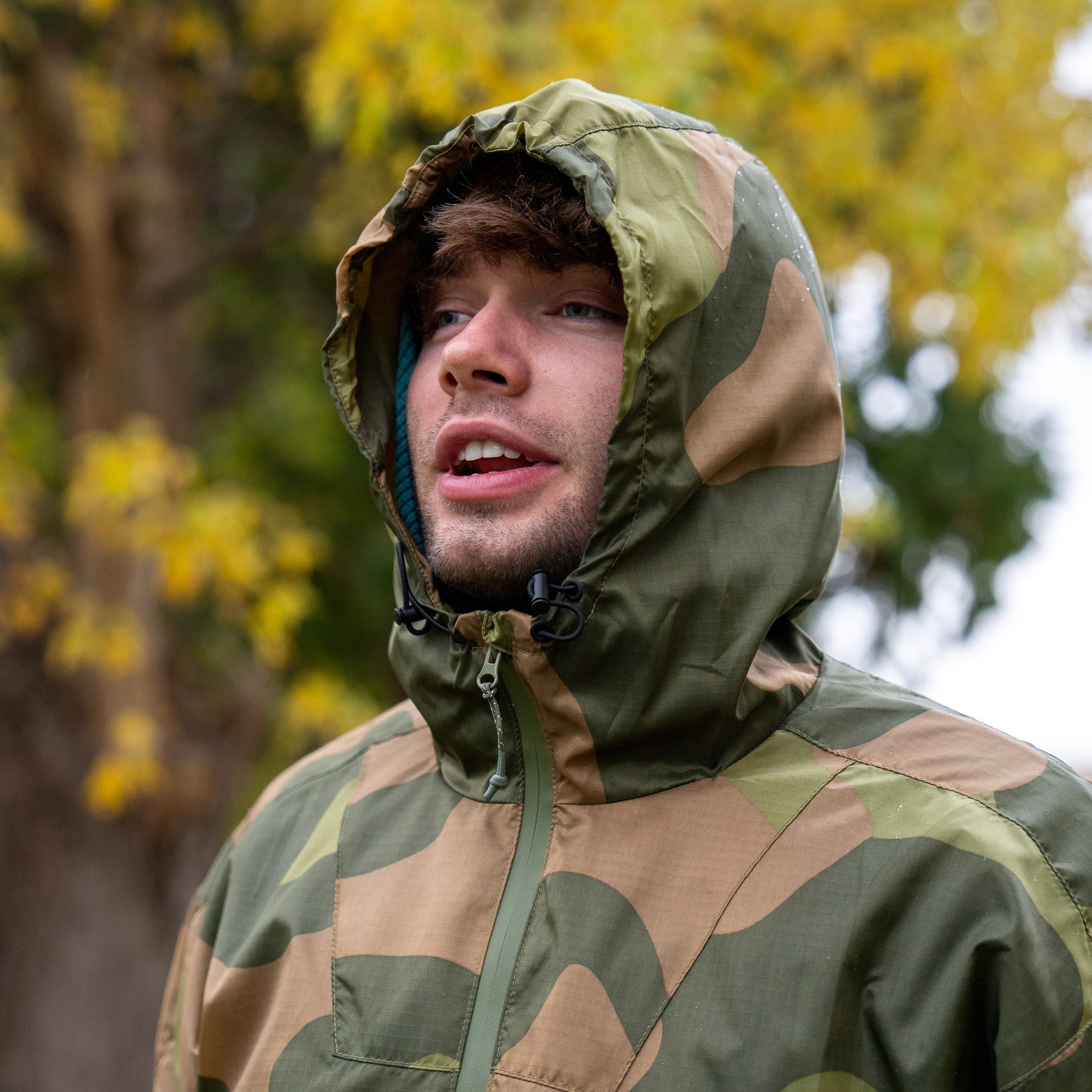 QILO x AP Retro Windbreaker in Norwegian Woodland with Americana Pipedream Apparel branding, featuring a lightweight, patterned jacket.