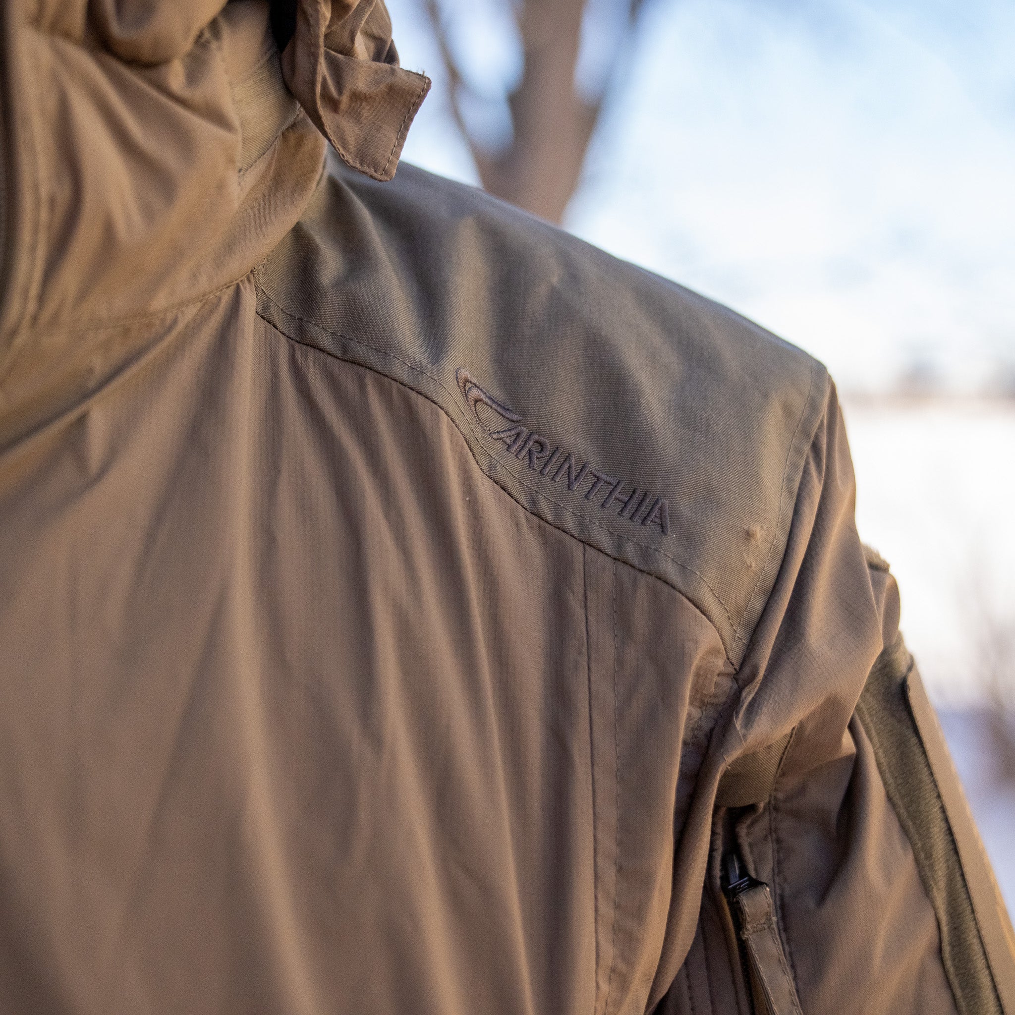 Americana Pipedream Apparel Carinthia HIG 4.0 jacket in black, showcasing its quilted design and high-performance outdoor style.