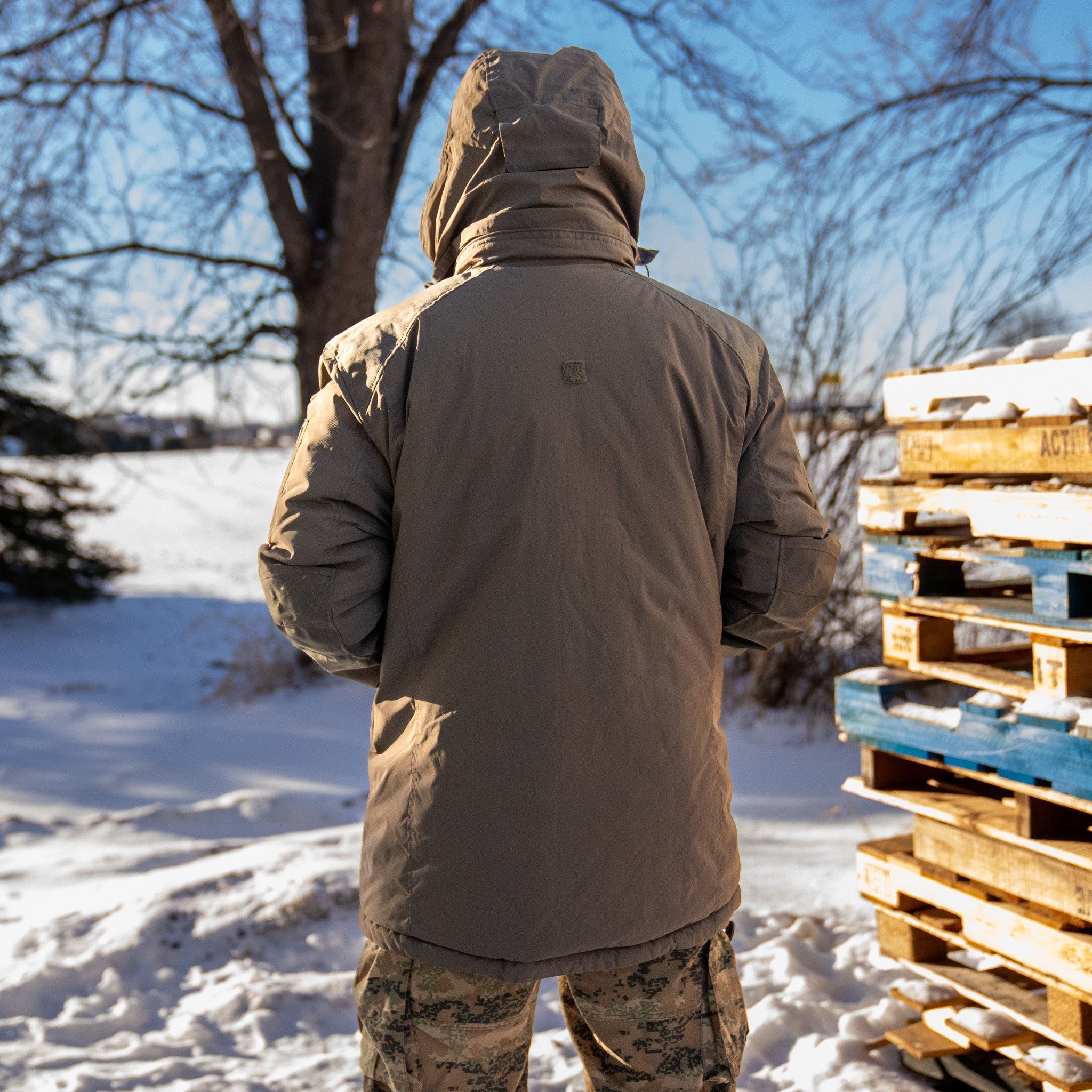 Carinthia HIG 4.0 jacket by Americana Pipedream Apparel, shown in a close-up with detailed fabric texture and zipper features.