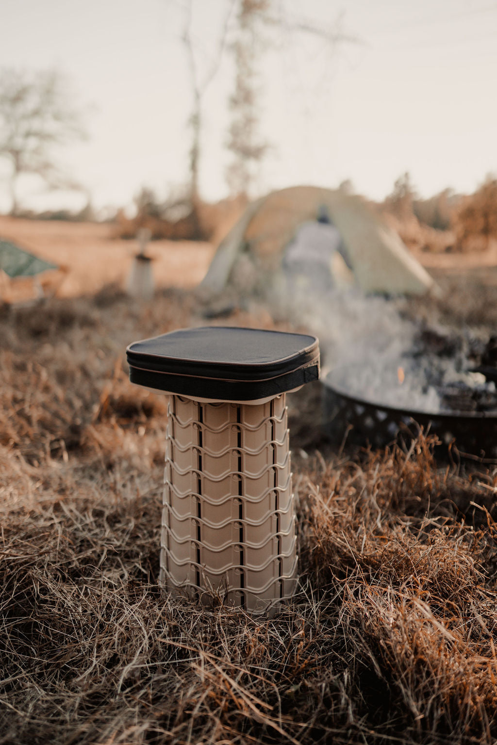 EverUncharted Nomad Cush in black-brown fabric with textured design, placed on a wooden surface.