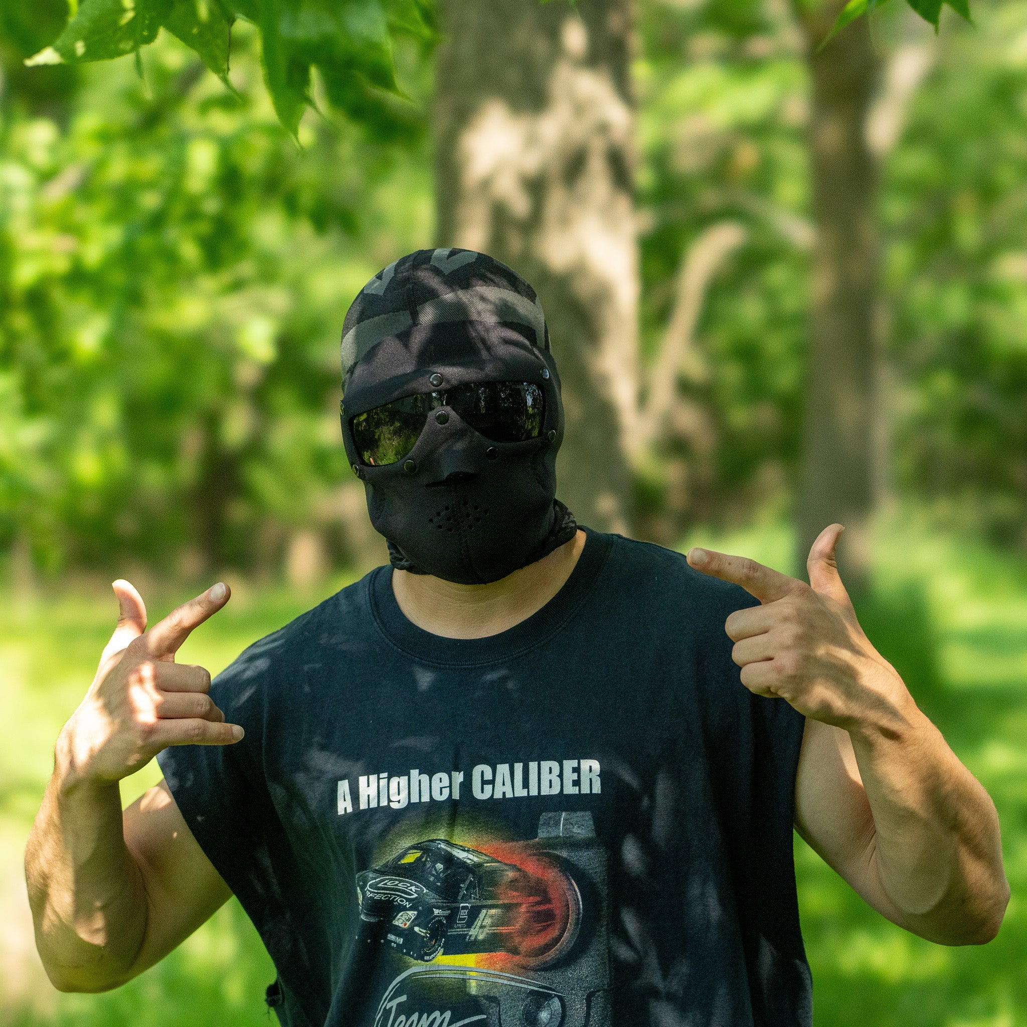 Black neoprene mask with ballistic smoke lenses by Americana Pipedream Apparel, displayed against a neutral background.