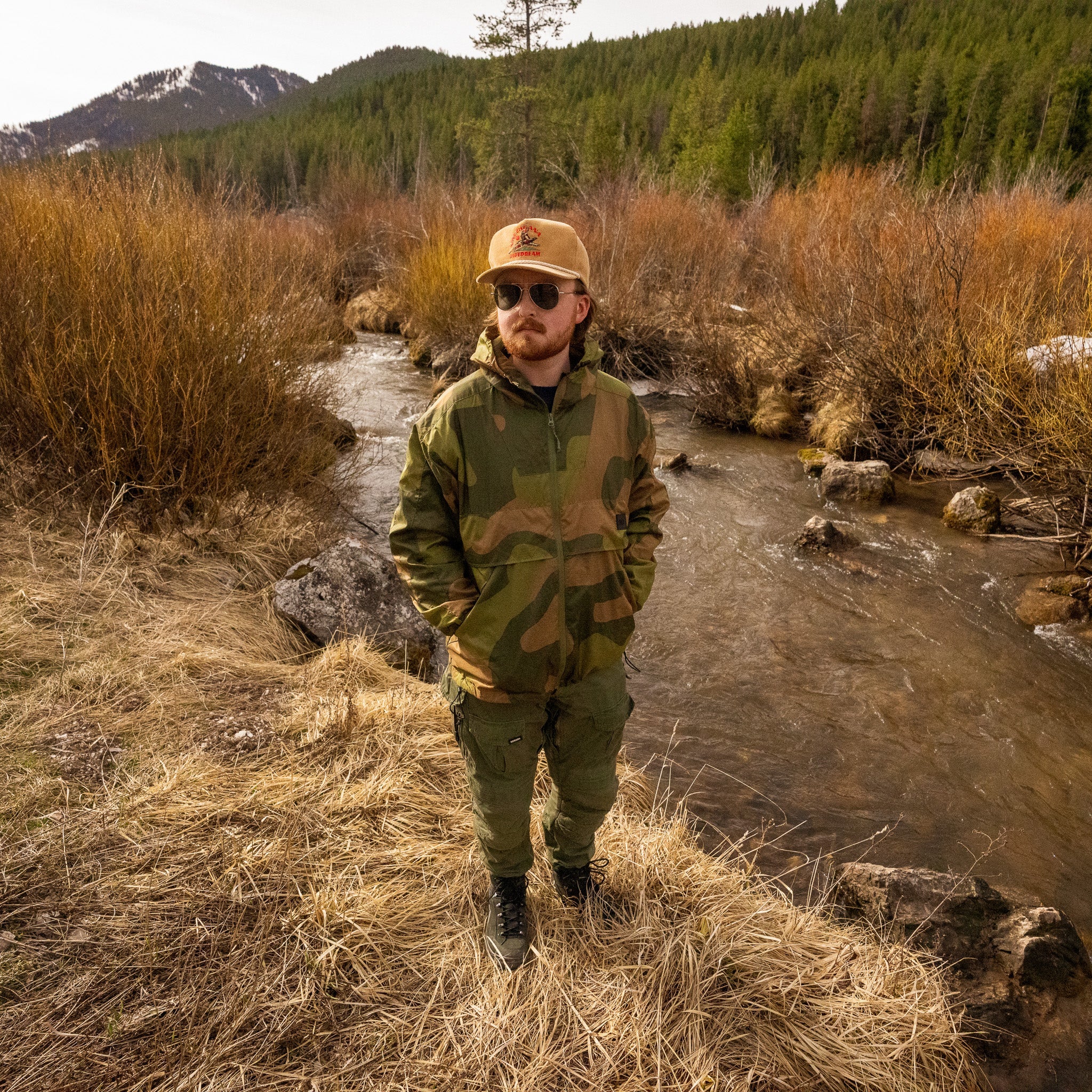 Norwegian Woodland QILO x AP retro windbreaker in Americana Pipedream Apparel, front view showing detailed camouflage pattern.