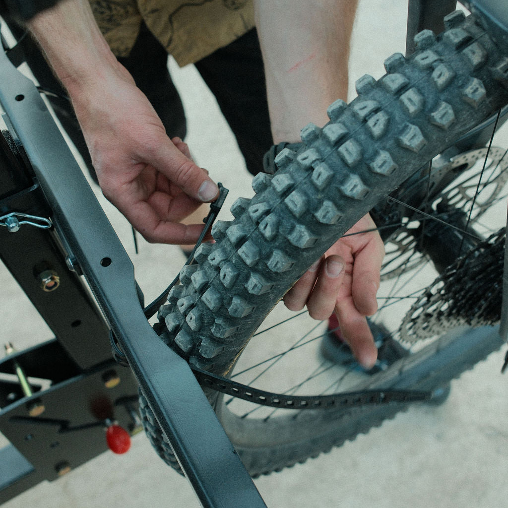Chuck 4-bike vertical rack holds four bicycles securely, featuring durable metal construction and space-saving design.