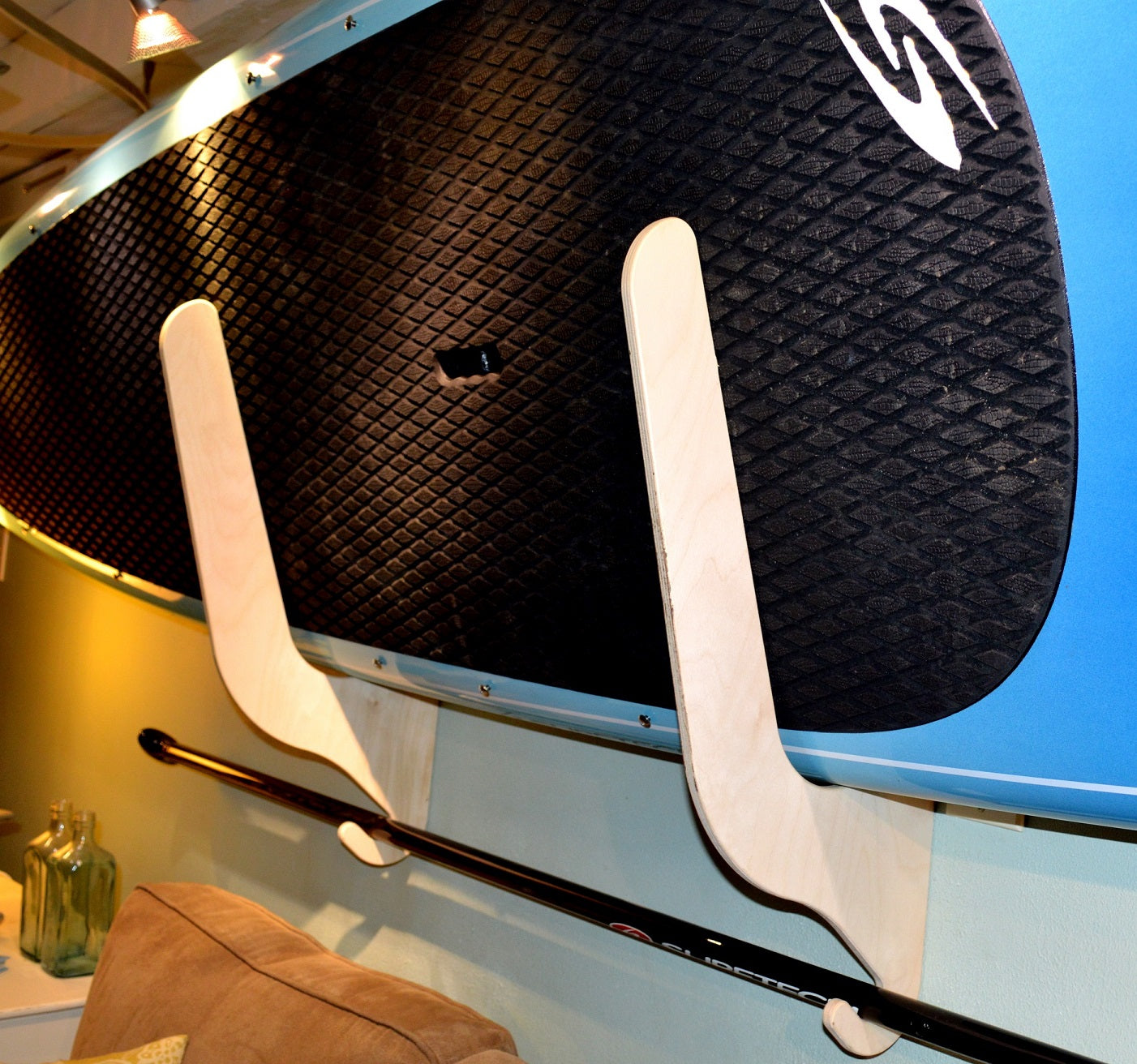 Rado Racks THE HARBOR paddle board rack, showcasing a sturdy design for holding SUP boards securely on a wall.