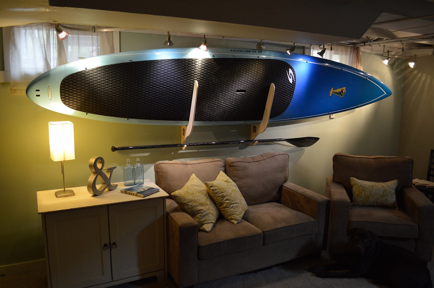Rado Racks THE HARBOR paddle board rack displaying multiple SUP boards in a garage setting.