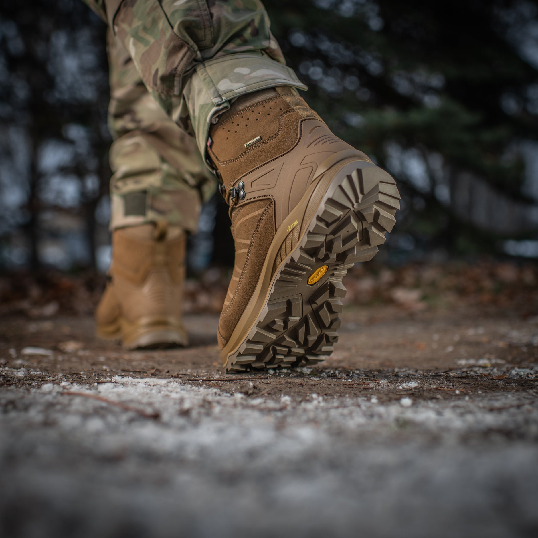 M-Tac tactical winter boots with rugged design, waterproof exterior, and sturdy soles for outdoor tactical use.