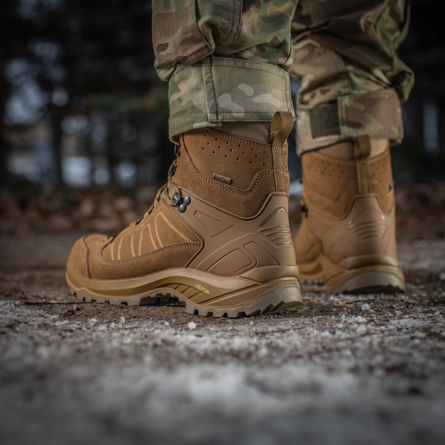 M-Tac tactical winter boots with rugged design, waterproof material, and sturdy soles for outdoor and tactical use.