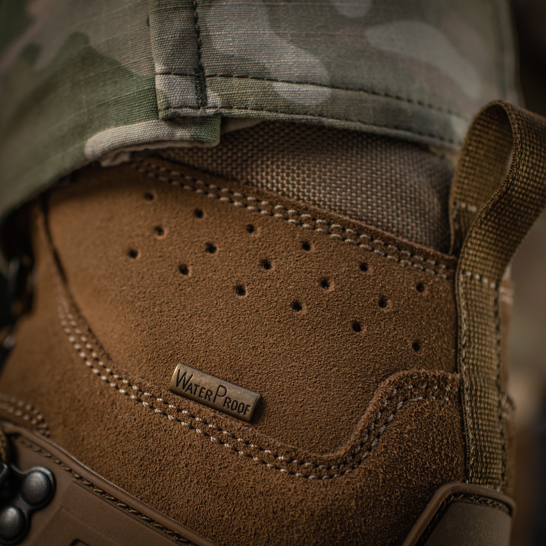 M-Tac tactical winter boots with rugged black leather and reinforced soles, designed for cold-weather outdoor performance.