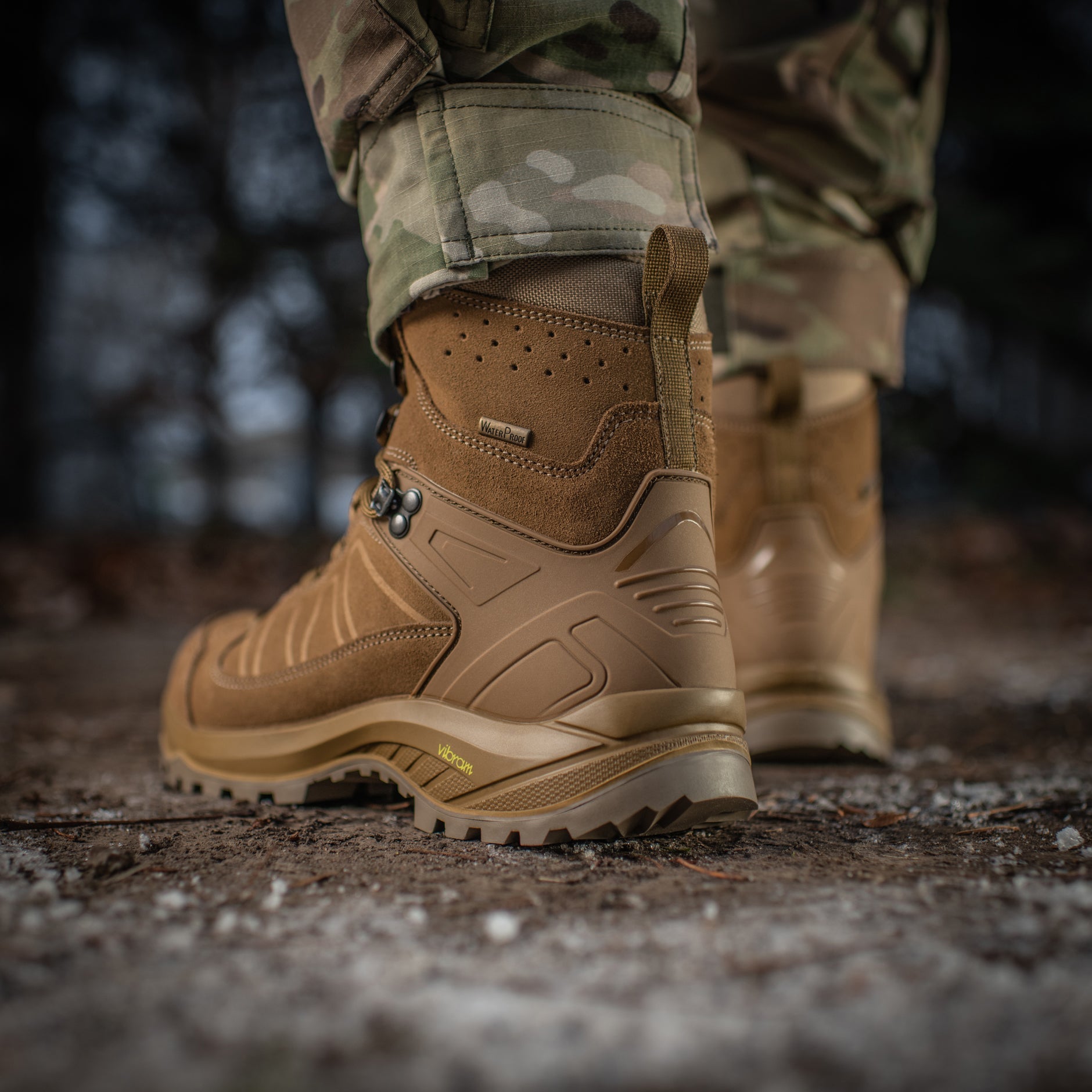 M-Tac tactical winter boots with rugged design, waterproof material, and sturdy soles, suitable for outdoor and tactical use.