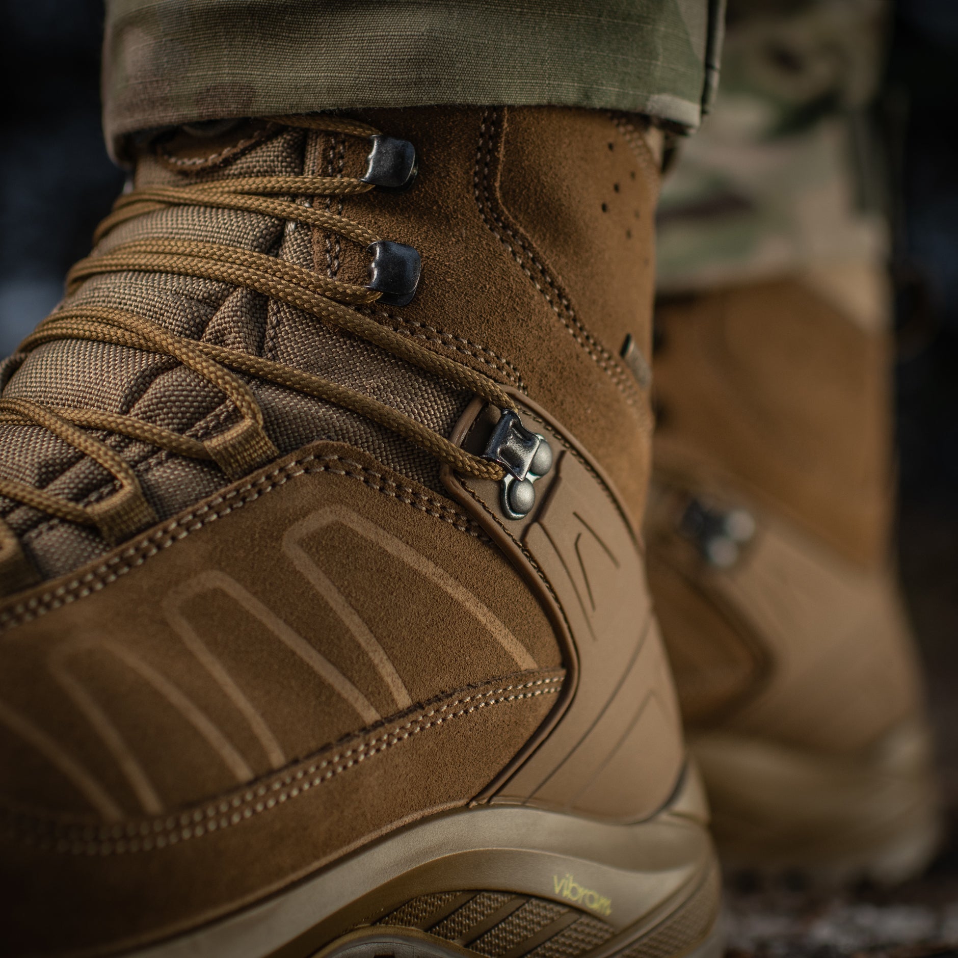 M-Tac tactical winter boots with rugged design, waterproof material, and insulated lining for cold weather outdoor activities.