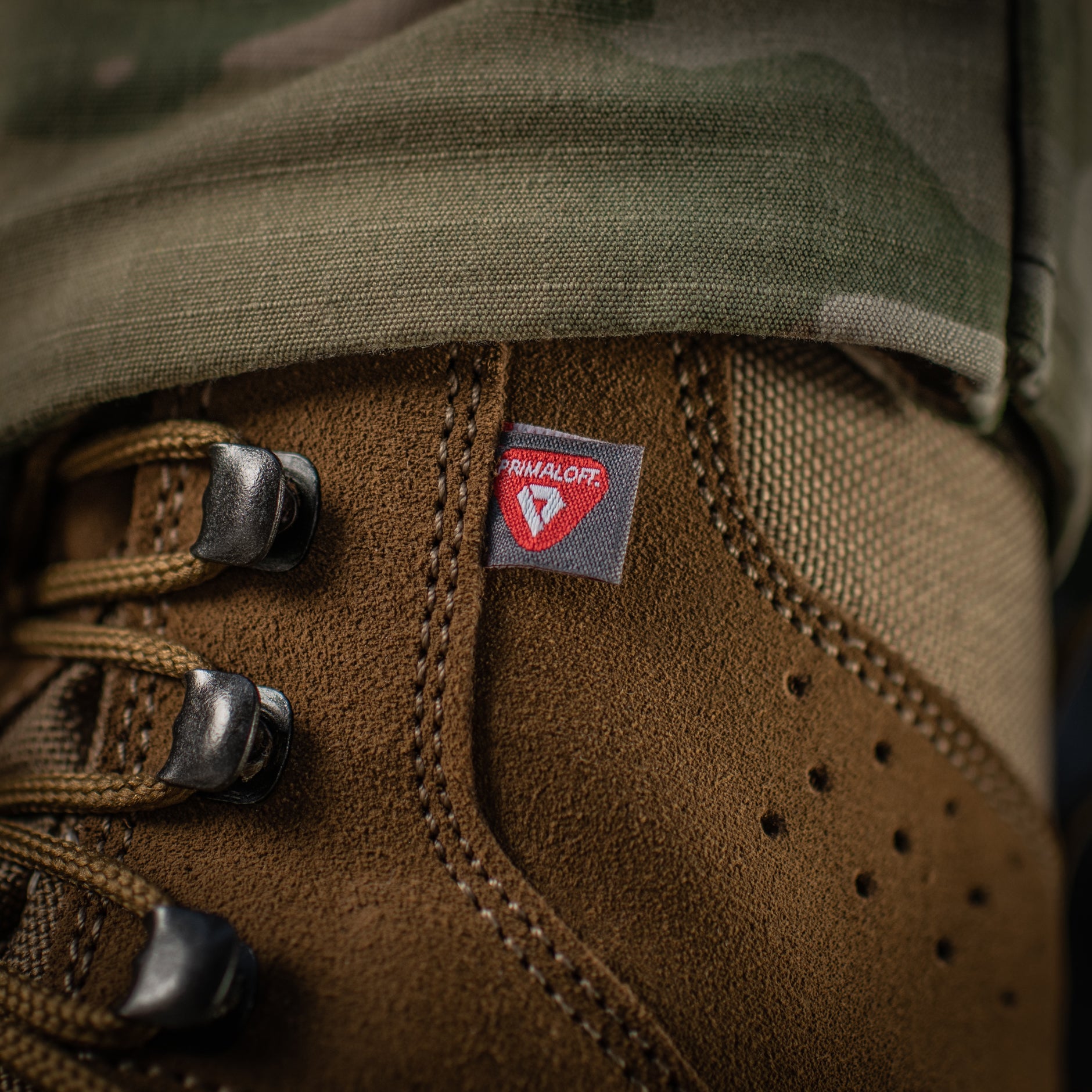 M-Tac tactical winter boots with rugged design, durable sole, and insulated lining for cold weather outdoor activities.