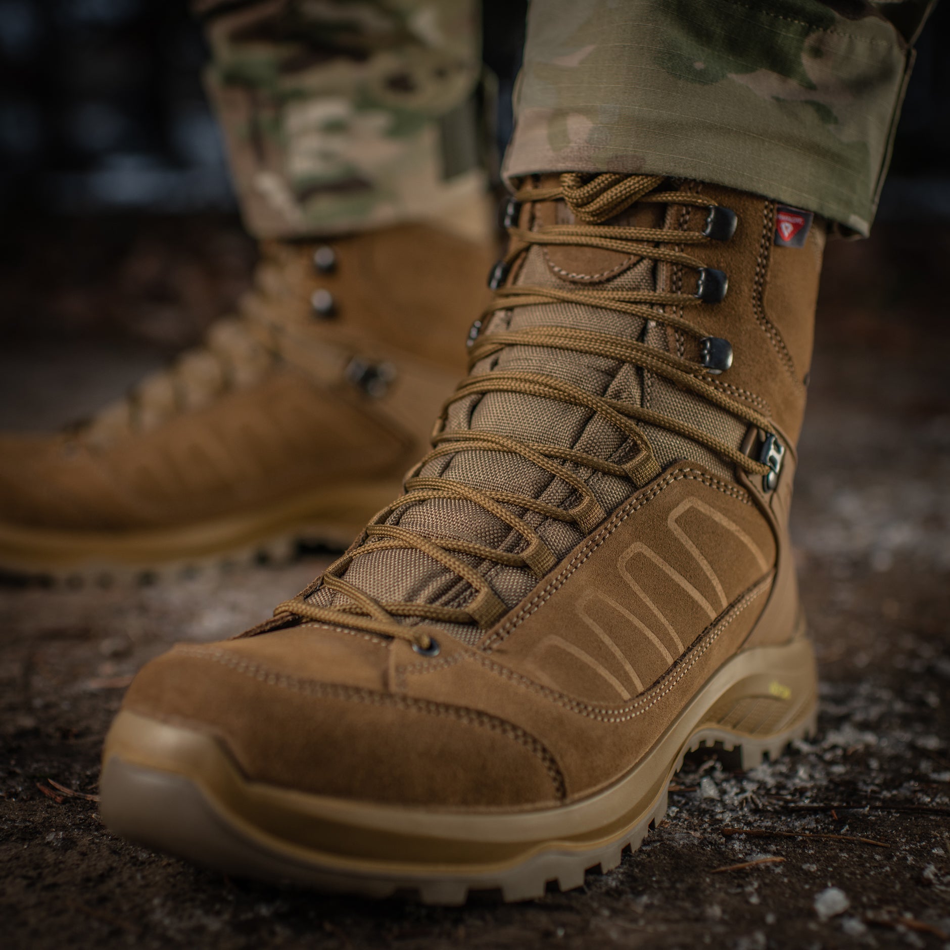 M-TAC tactical winter boots with rugged design, insulated for cold weather, featuring durable waterproof material and sturdy soles.