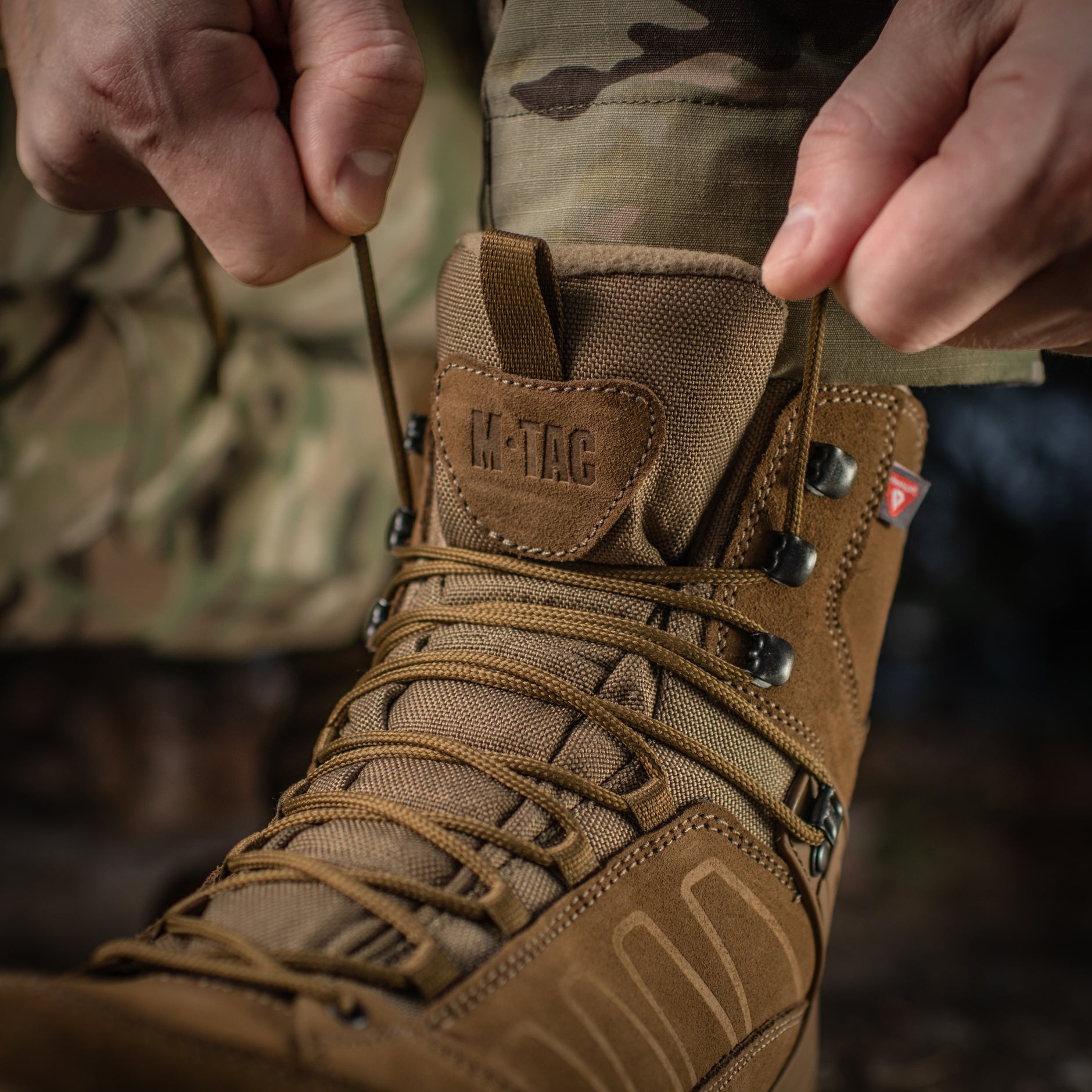 M-Tac tactical winter boots with rugged black leather and durable rubber soles, designed for cold-weather outdoor use.