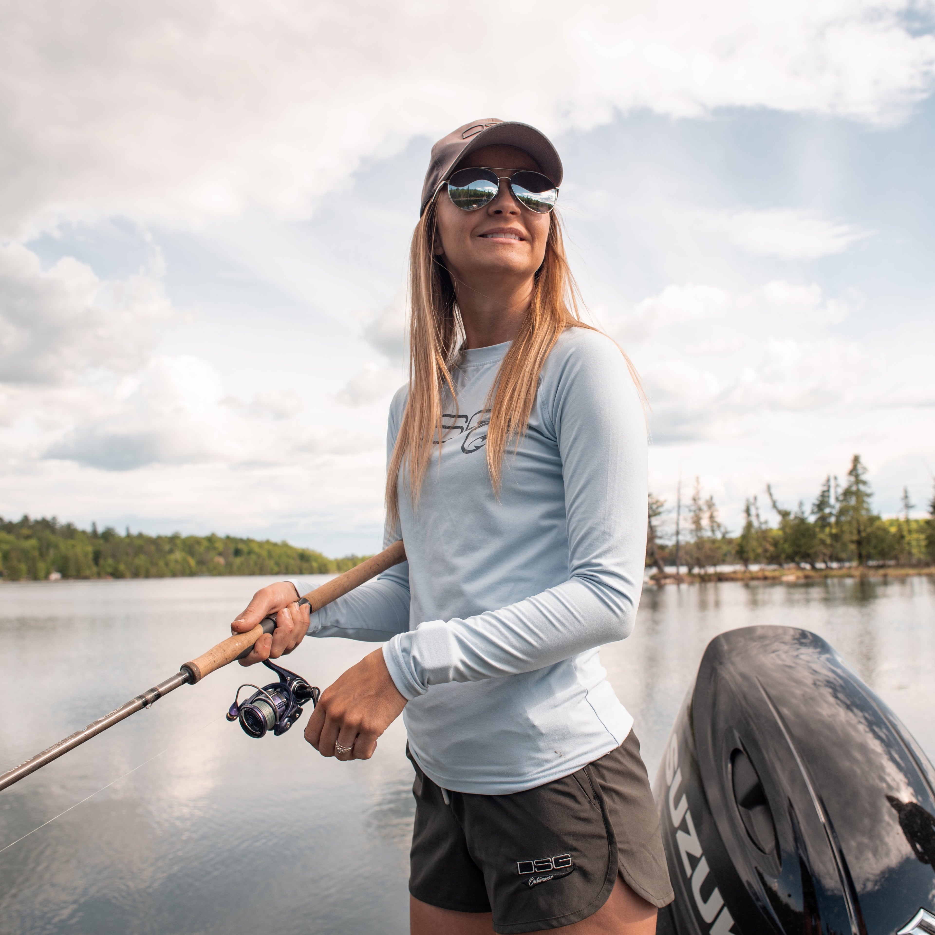 Solid fishing shirt by DSG OUTERWEAR with UPF 50+ sun protection, shown in a light, breathable fabric suitable for outdoor fishing.