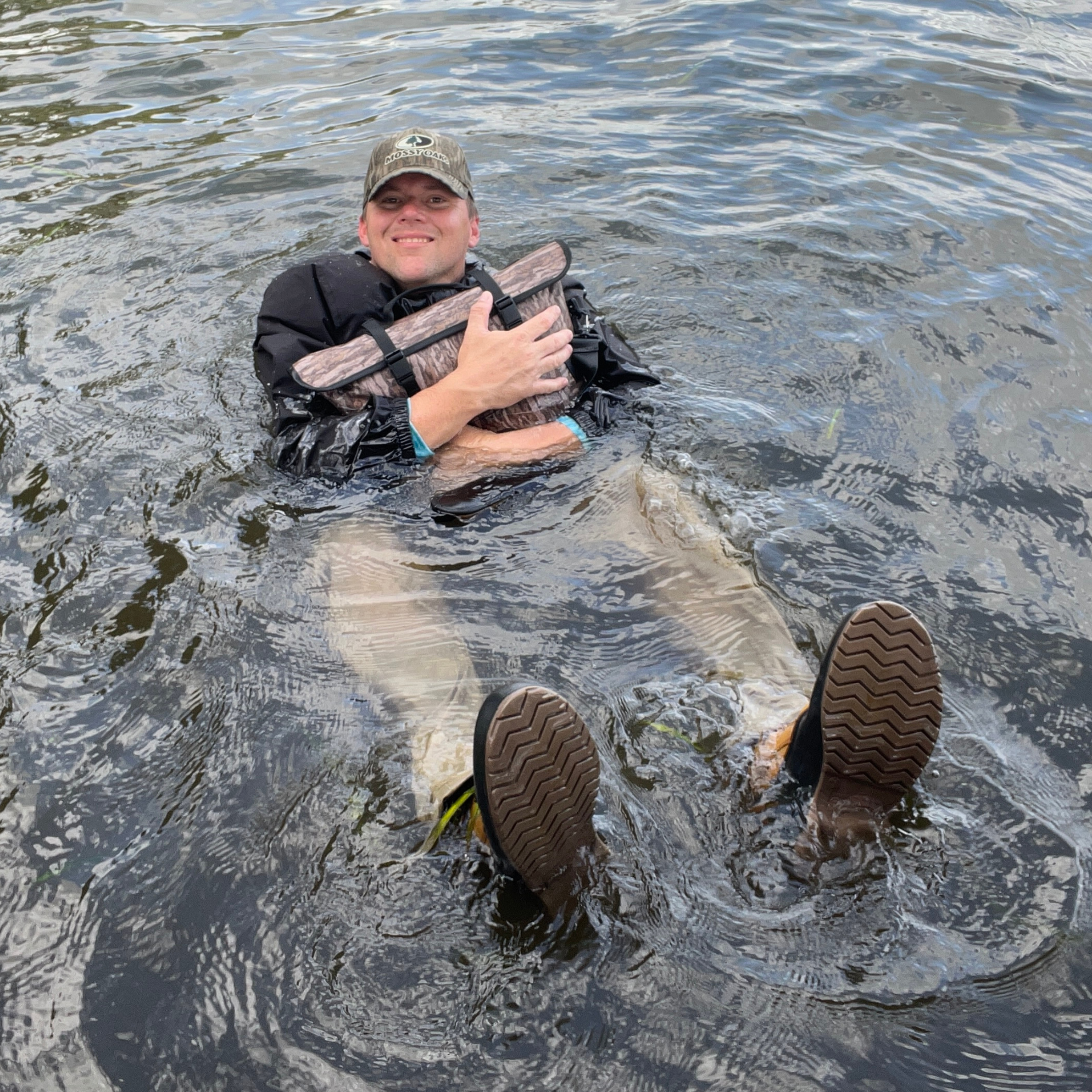 Dry Pocket waterproof floating cooler bag with auto sealing features, designed for outdoor use and easy portability.