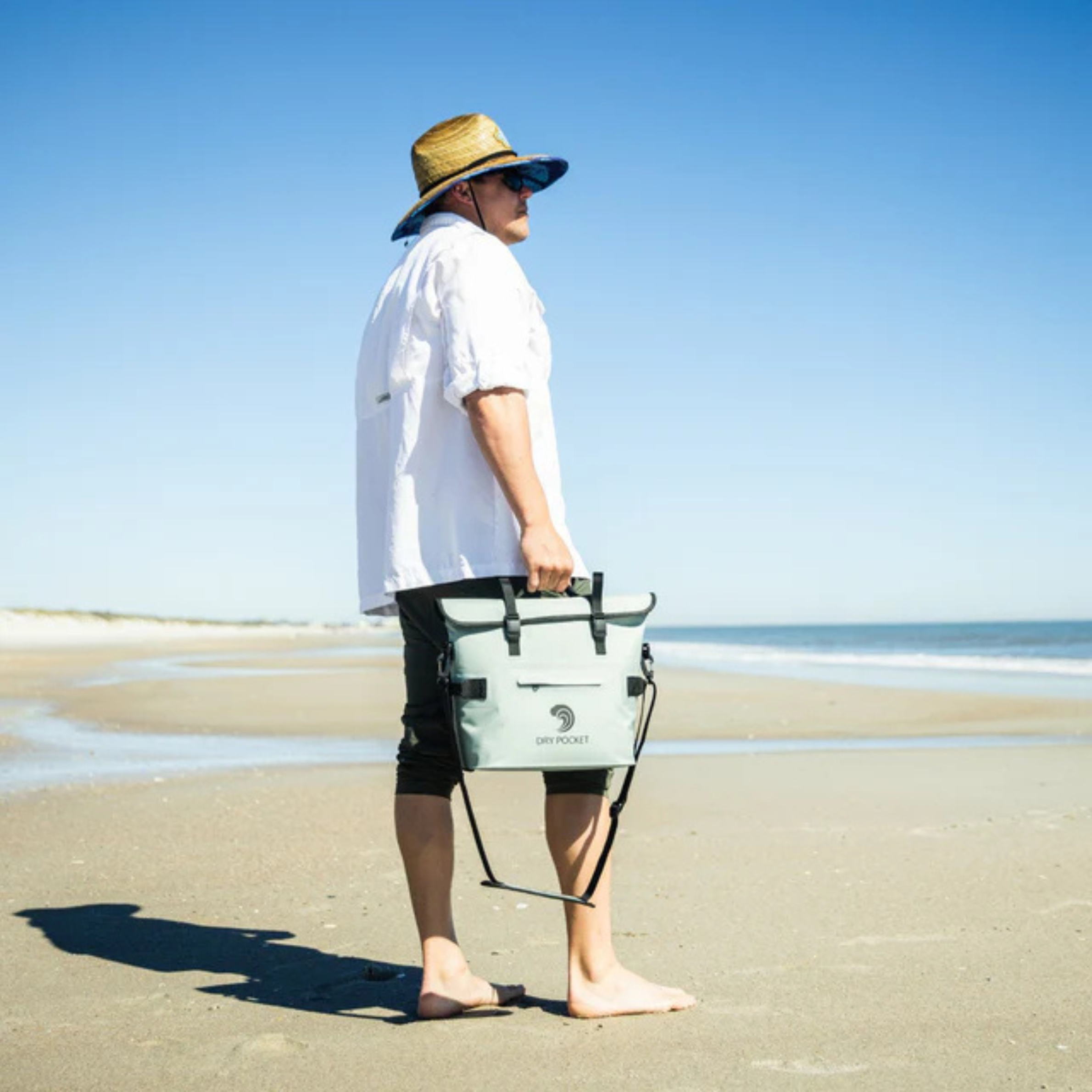 Waterproof floating cooler bag by Dry Pocket, featuring an auto sealing design and vibrant color for outdoor use.