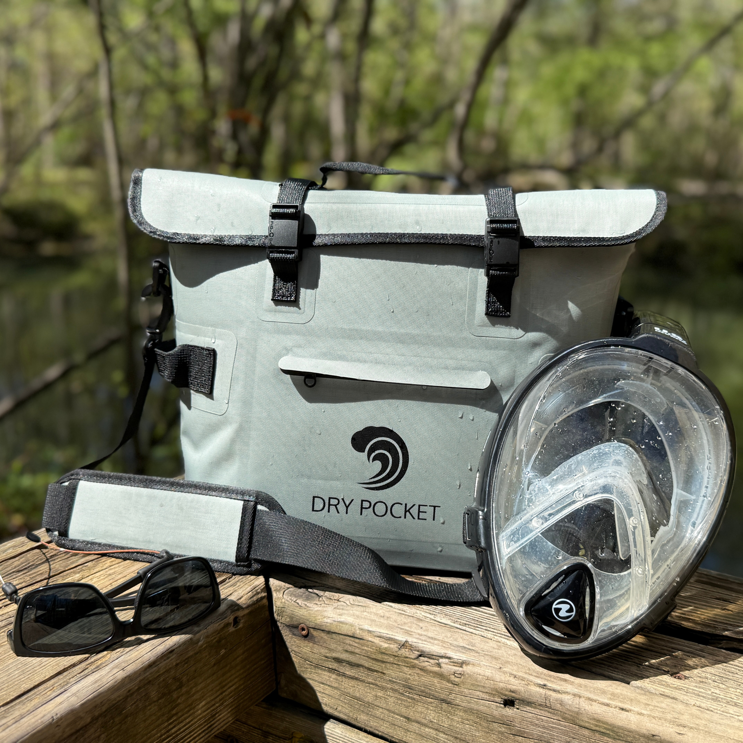 Waterproof floating cooler bag by Dry Pocket, featuring an auto sealing design for easy transport and outdoor use.