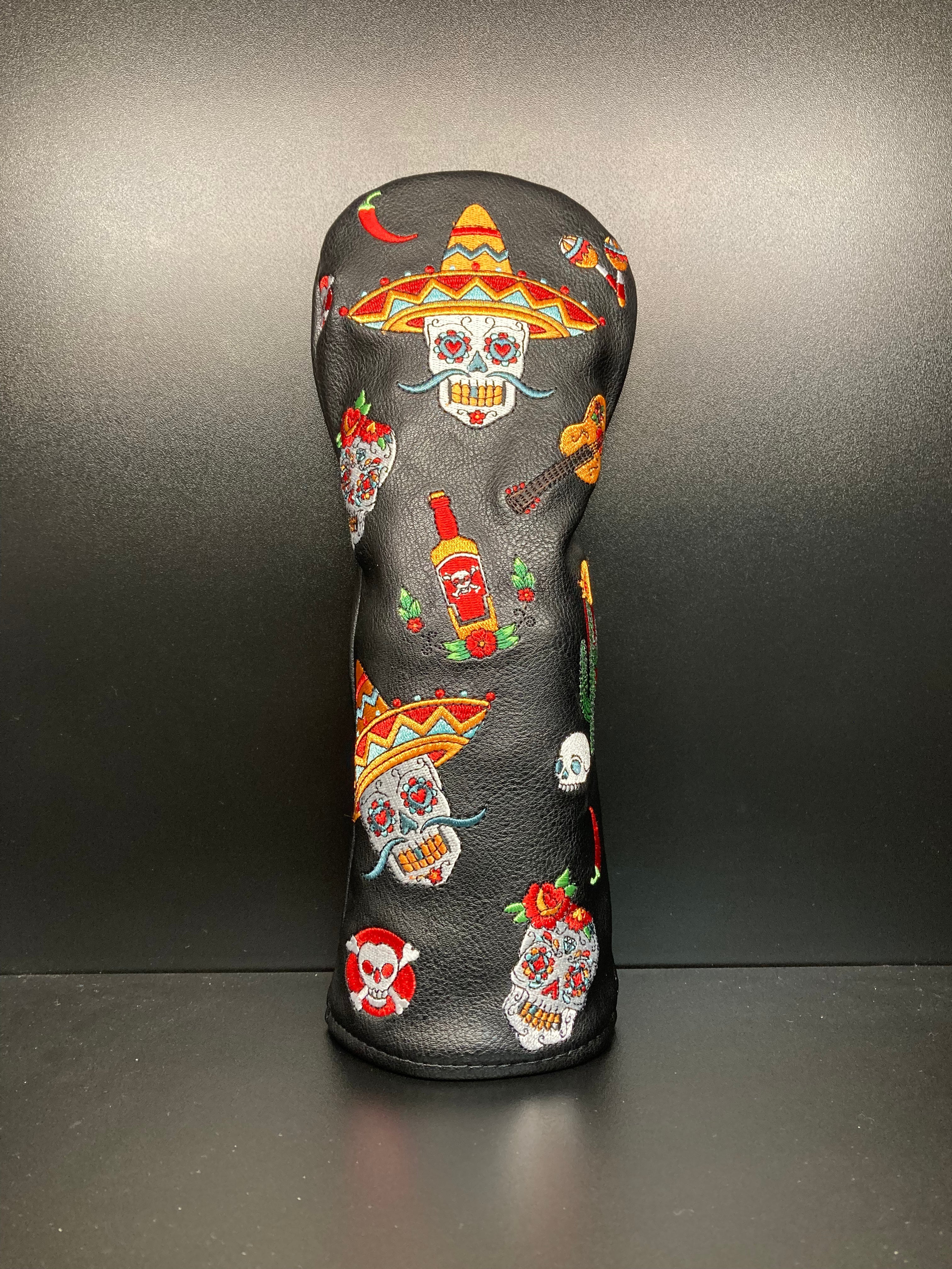 Dia De los Muertos themed golf club headcover by ParWestGolf featuring vibrant skull and floral design.