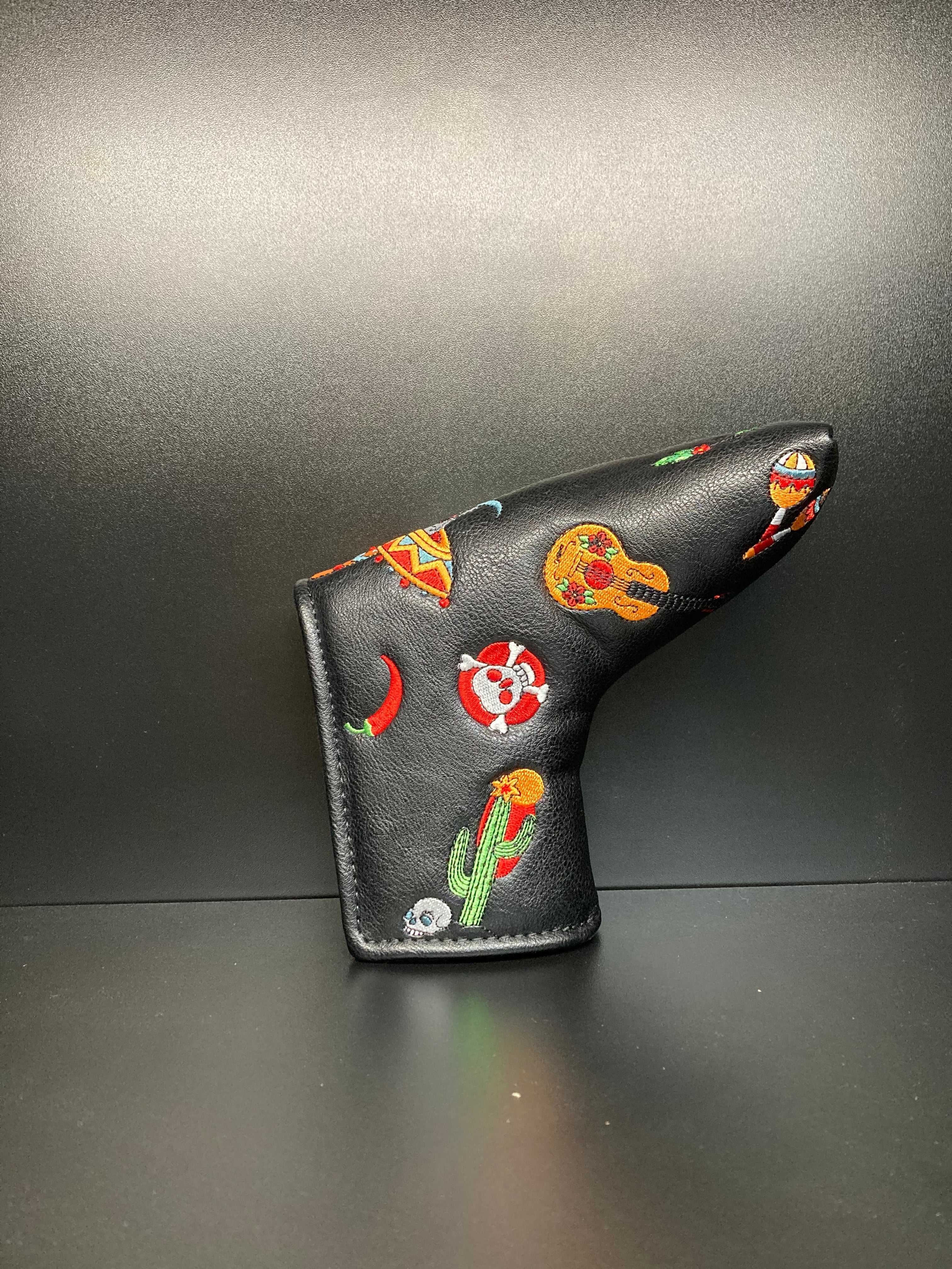Dia De los Muertos-themed golf club headcover by ParWestGolf with vibrant skull design and festive colors.