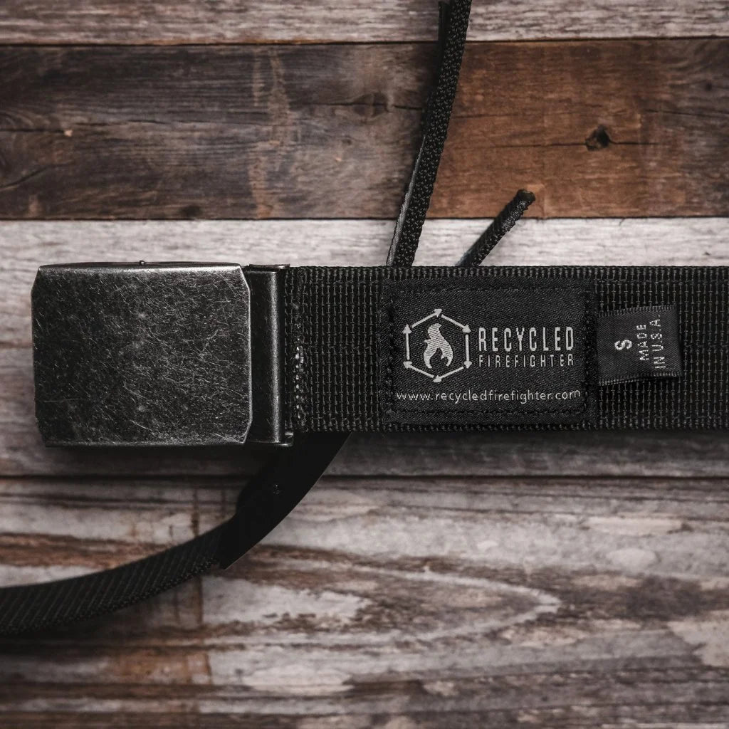 Recycled Firefighter double layer EDC belt with durable design and adjustable strap, shown in black against a neutral background.