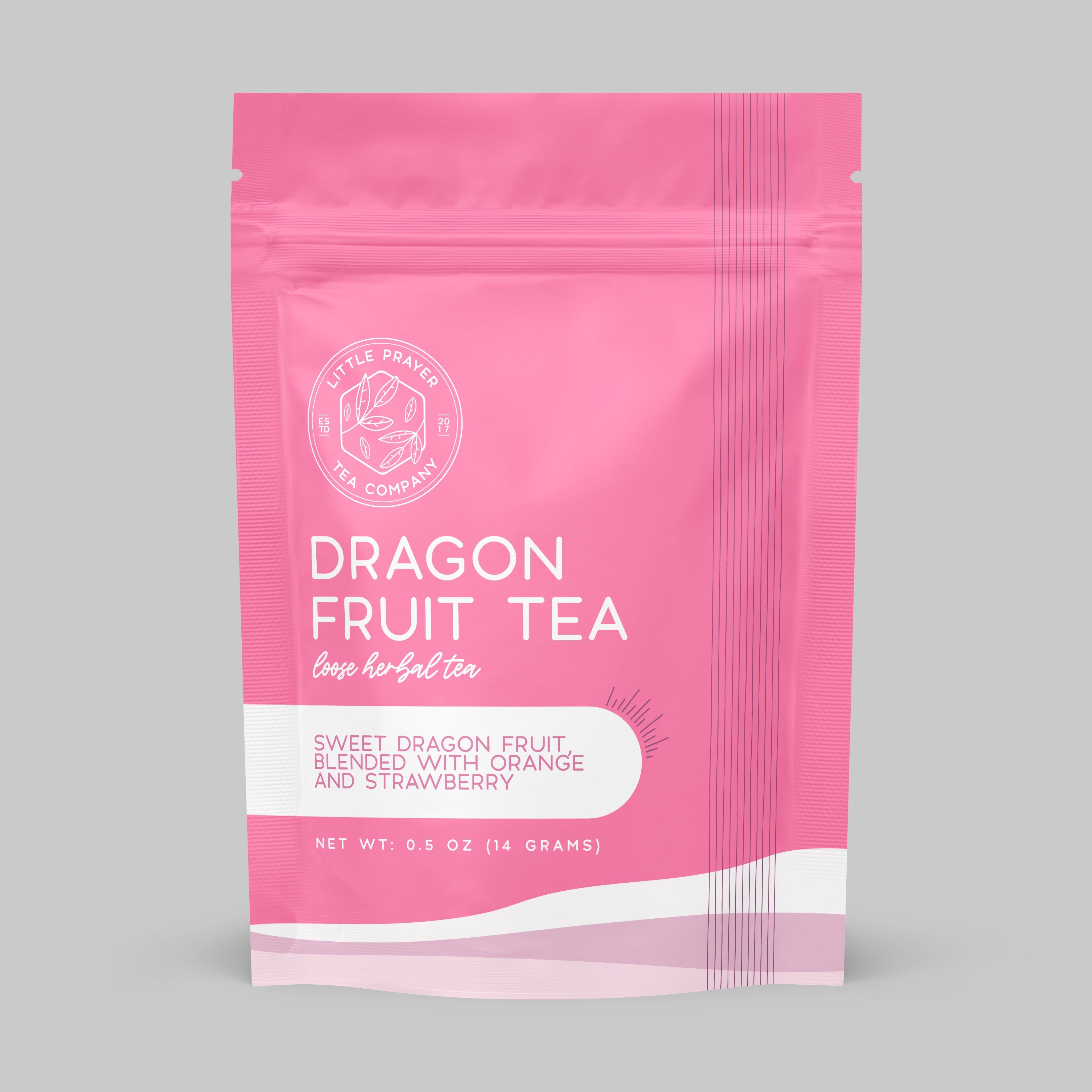 Herbal Dragonfruitea tea from Little Prayer Tea Company in a clear glass cup showing vibrant pink and purple tea with fresh dragonfruit slices.