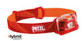 Petzl Tikkina headlamp with 250 lumens, black adjustable strap, and compact design for outdoor activities and hands-free lighting.